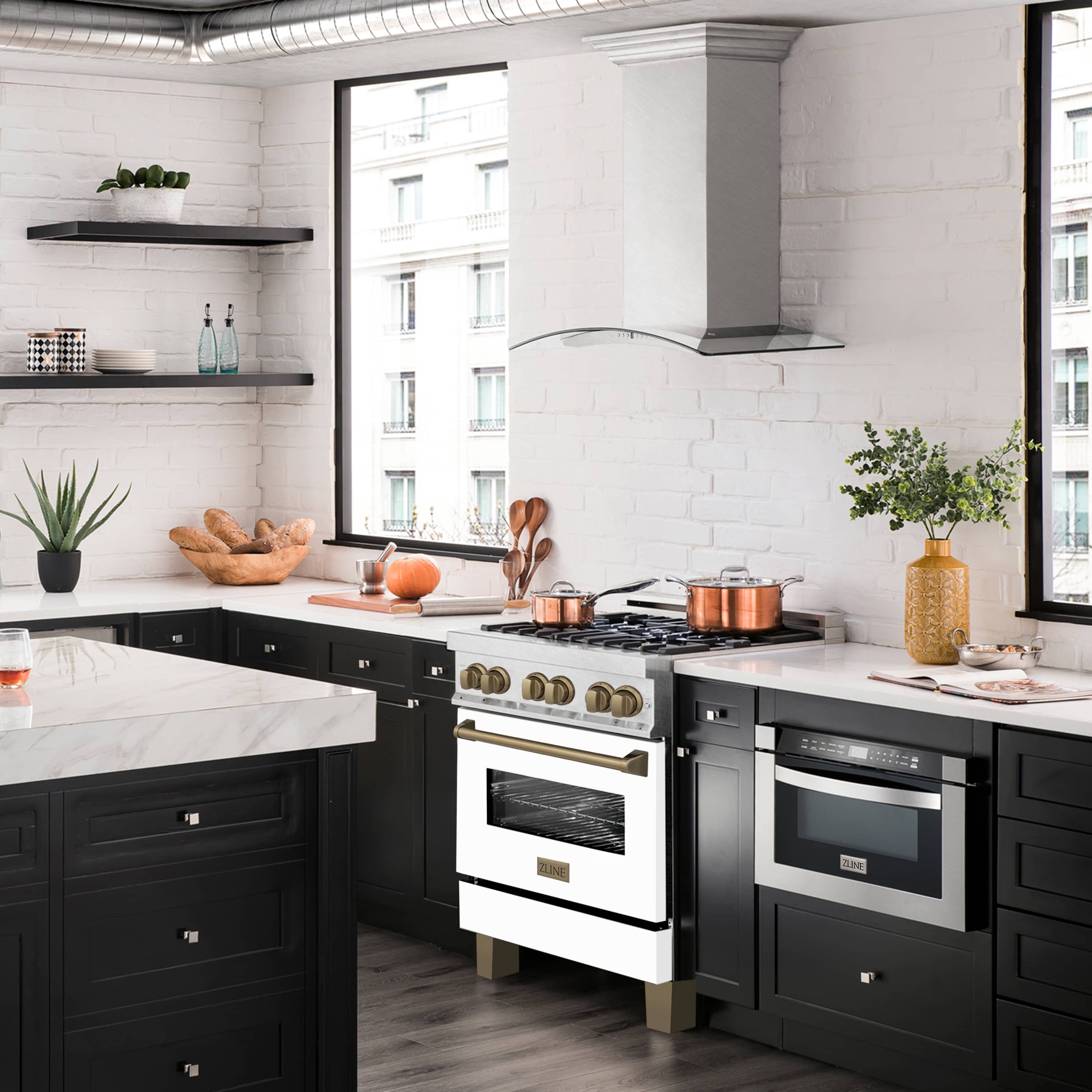 Dual fuel range with black cooktop, white oven door, and bronze control knobs