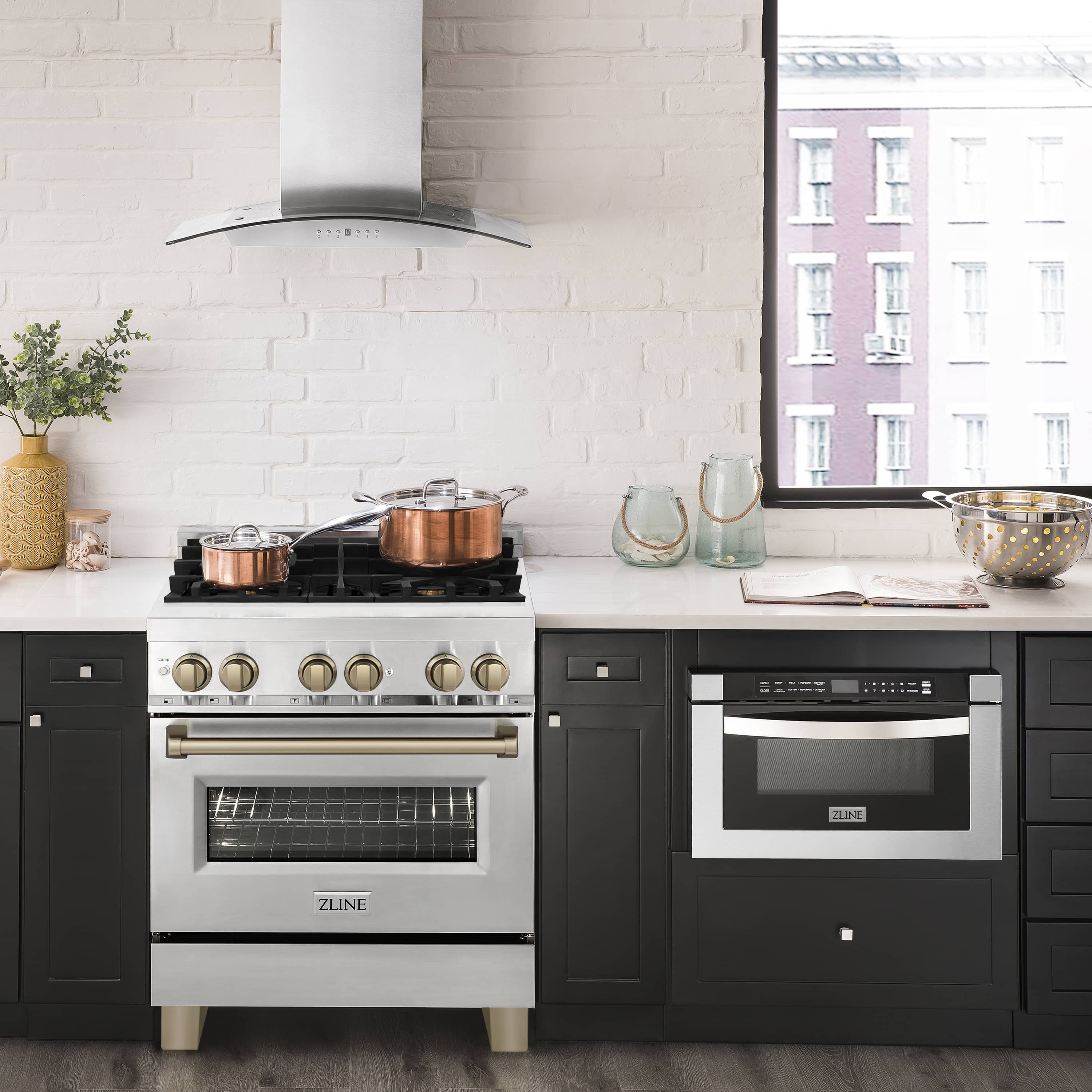 Dual fuel range with stainless oven door and champagne bronze control accents