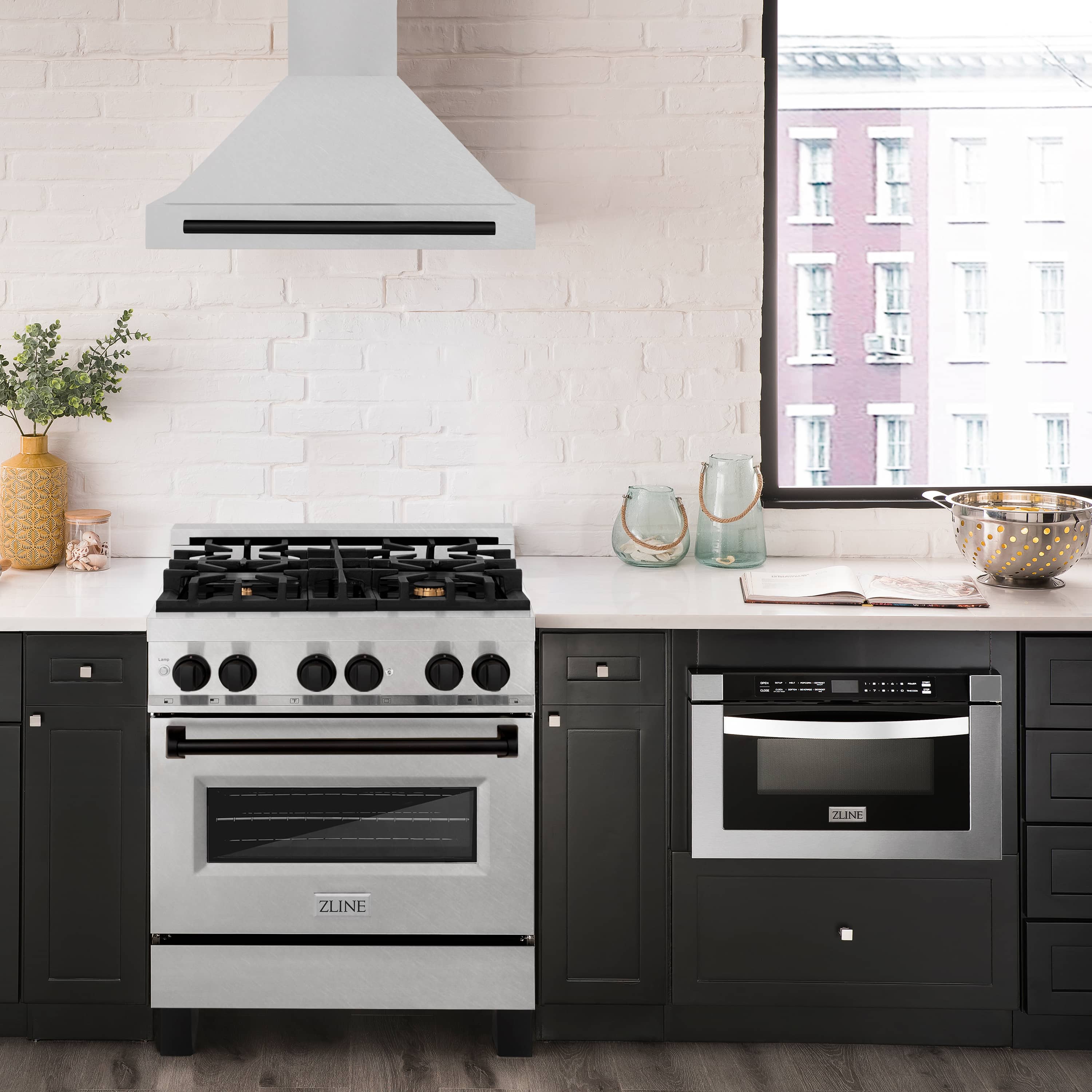 Wall-mounted range hood above stove with satin stainless body and matte black bar