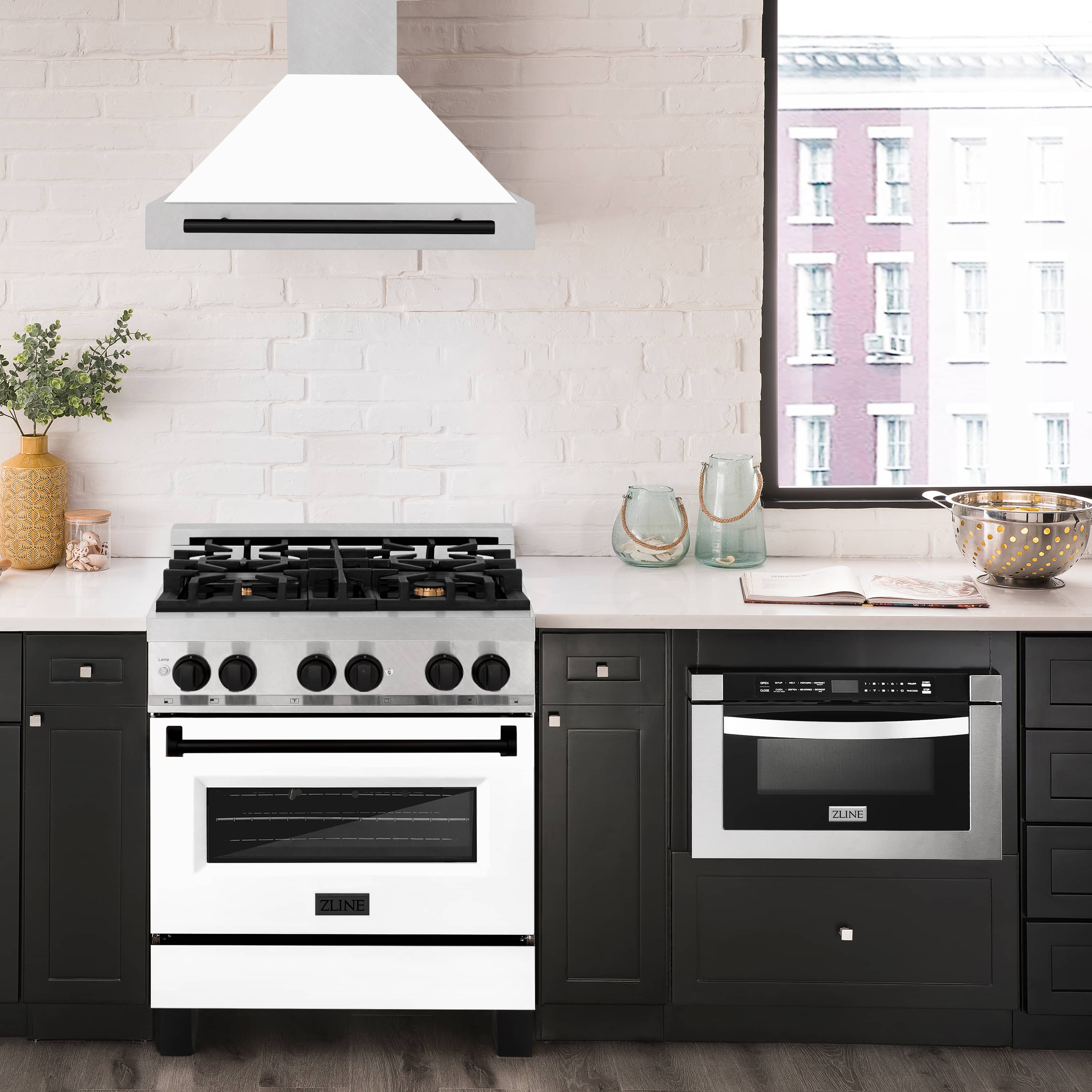 Wall-mounted range hood with white chimney and matte black vent bar above stove