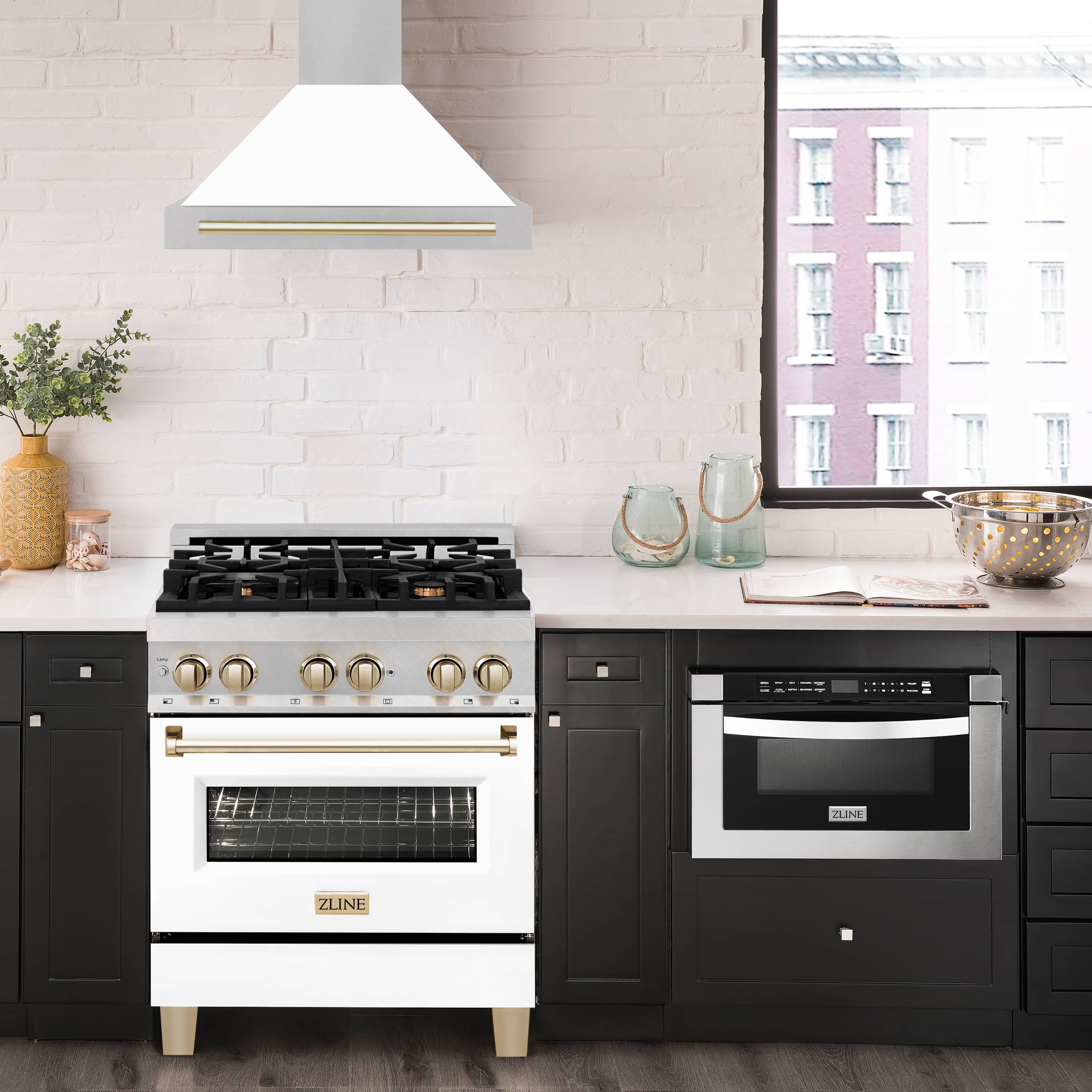 White wall-mounted range hood with gold bar accent over a gas cooktop
