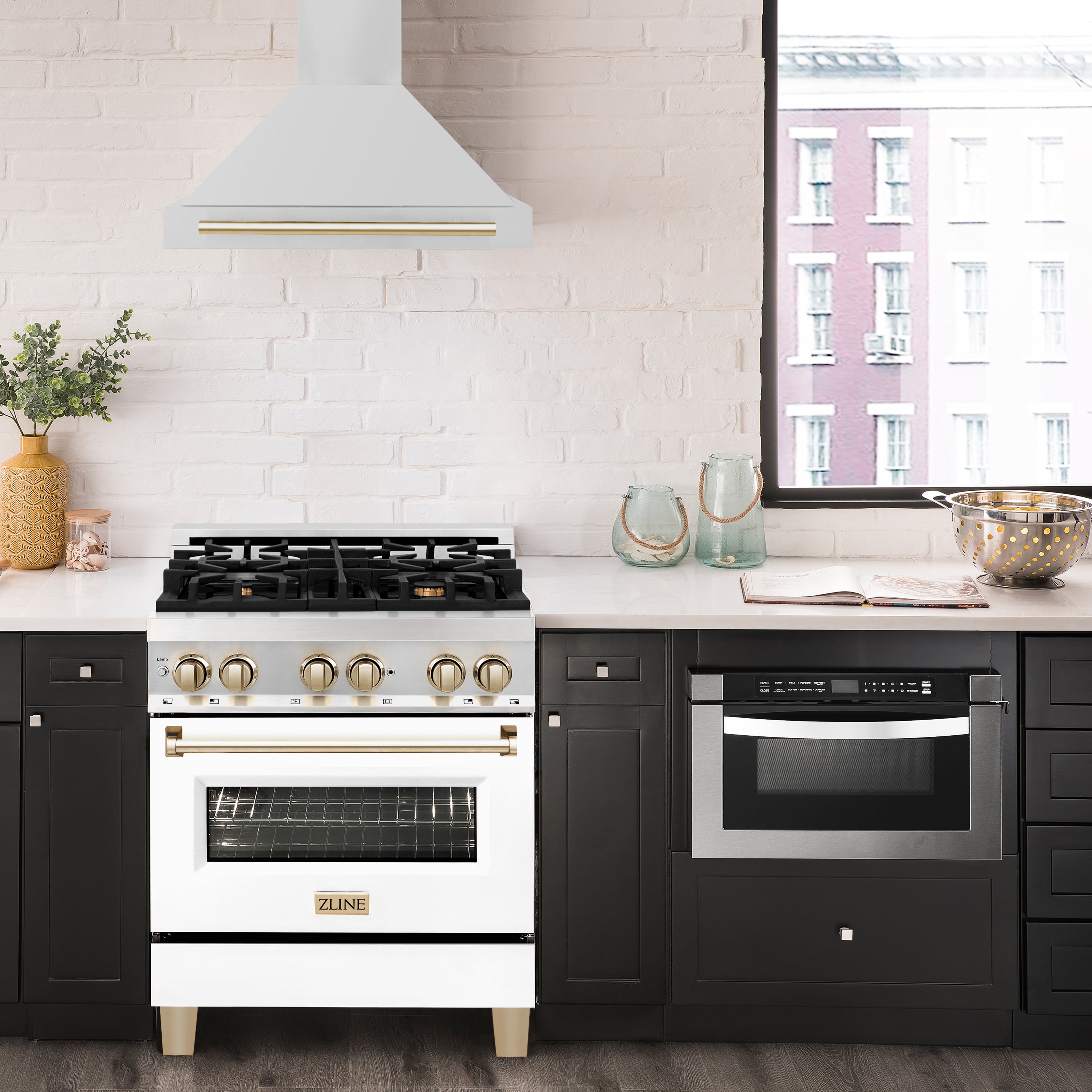 Wall-mounted range hood above a cooktop, white chimney with gold edge trim