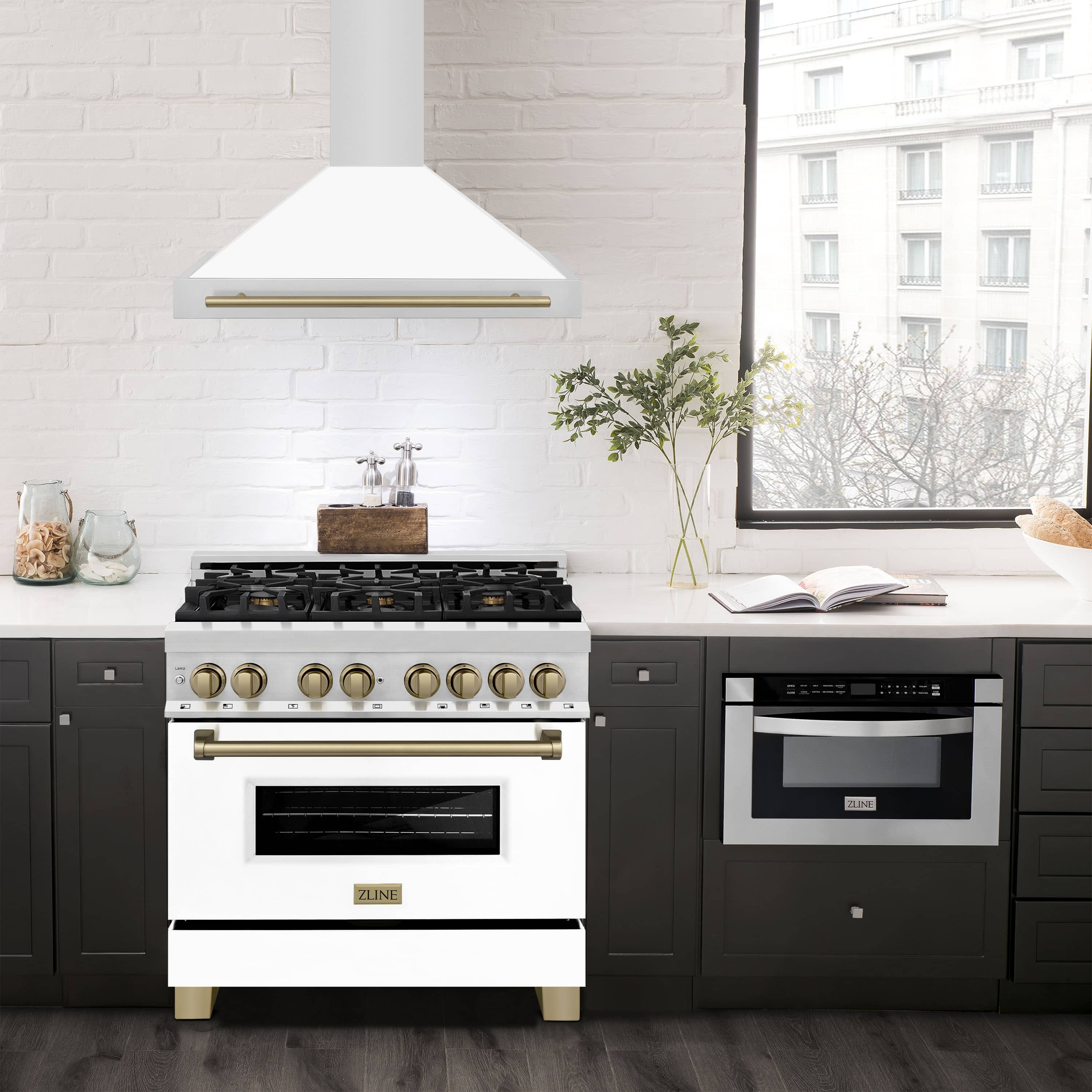 White matte wall range hood with bronze edge trim, centered above a cooktop