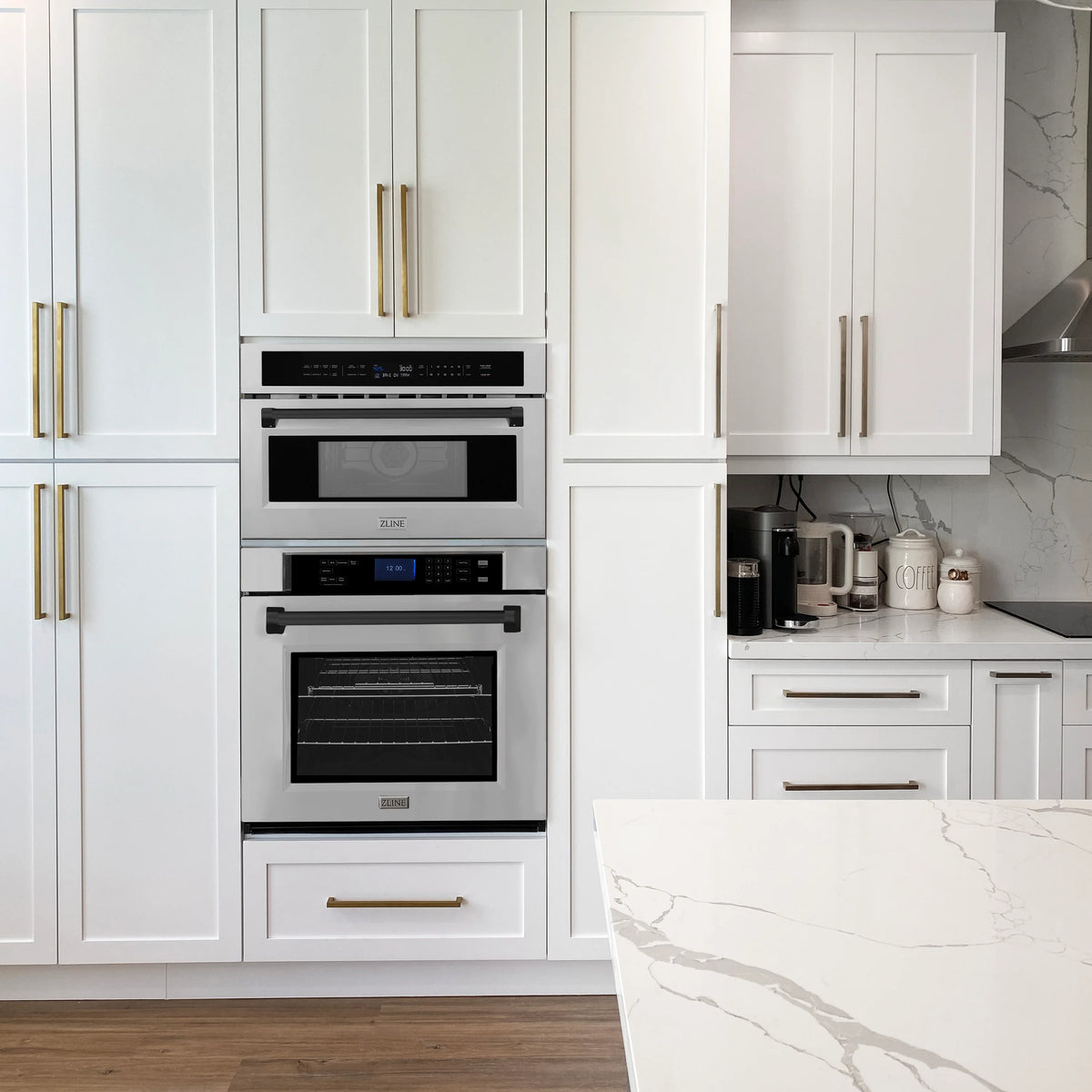 Built-in microwave and convection oven installed in white kitchen cabinetry