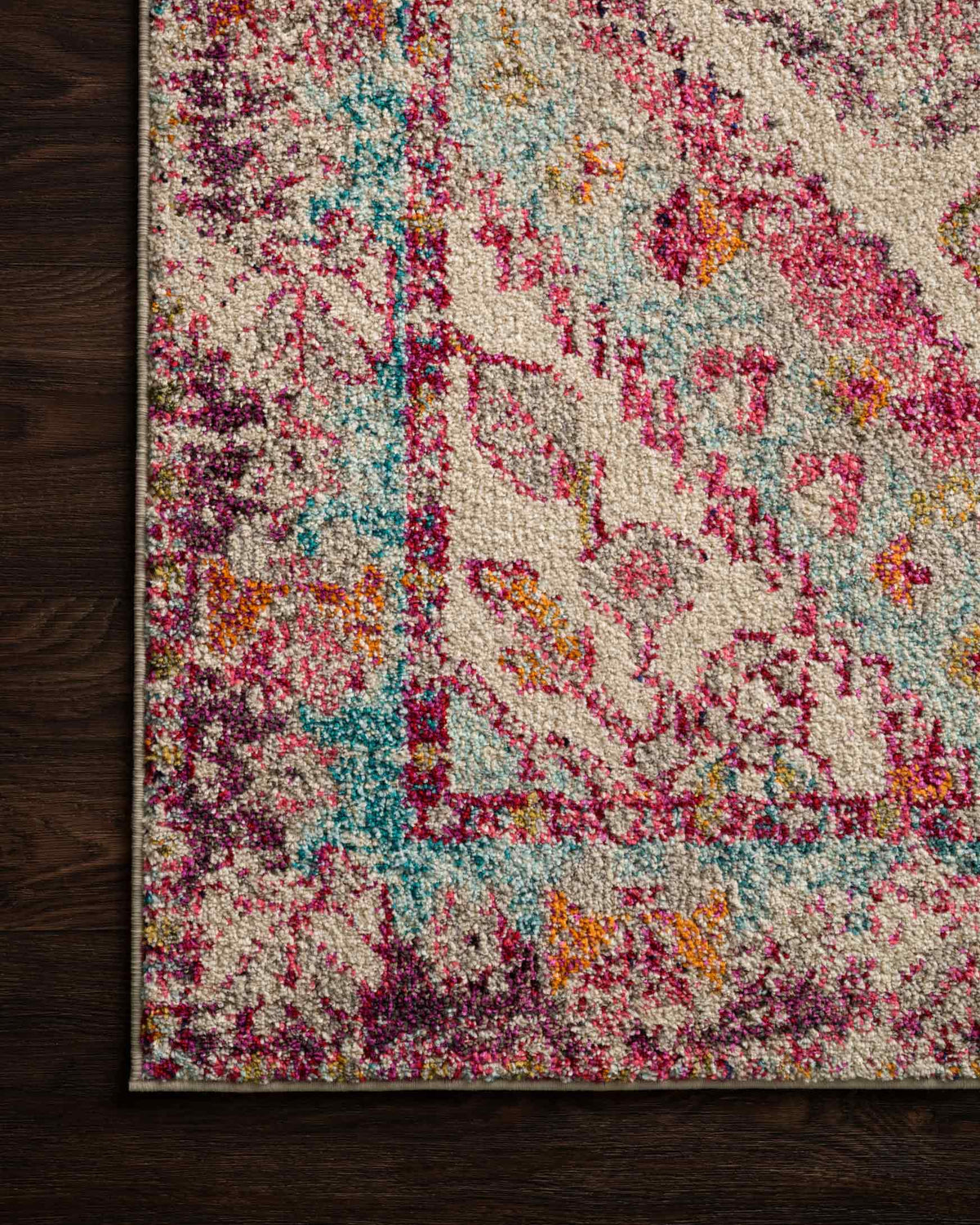 Aqua and pink distressed rug with medallion design and decorative border detail