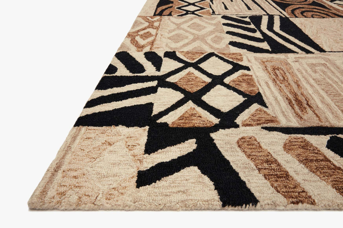 Contemporary hand-tufted rug corner with bold black, cream, and tobacco geometric pattern