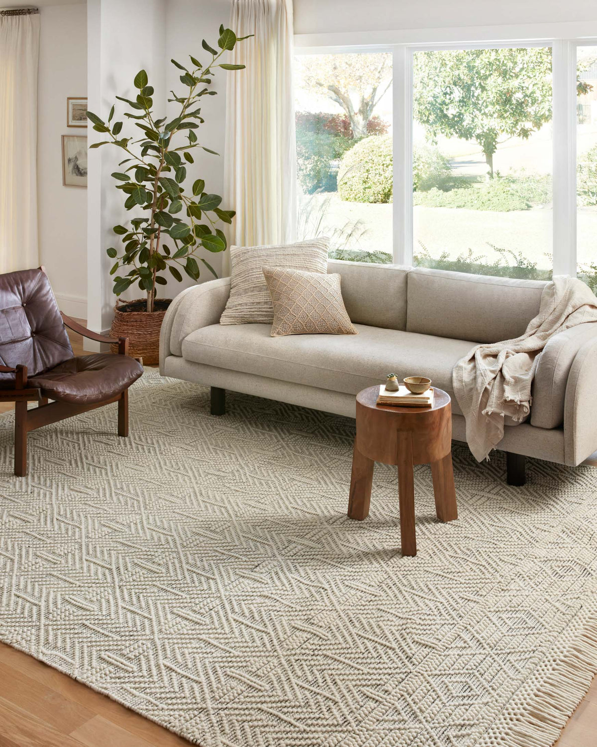 Ivory hand-woven rug with repeating zigzag and diamond motifs