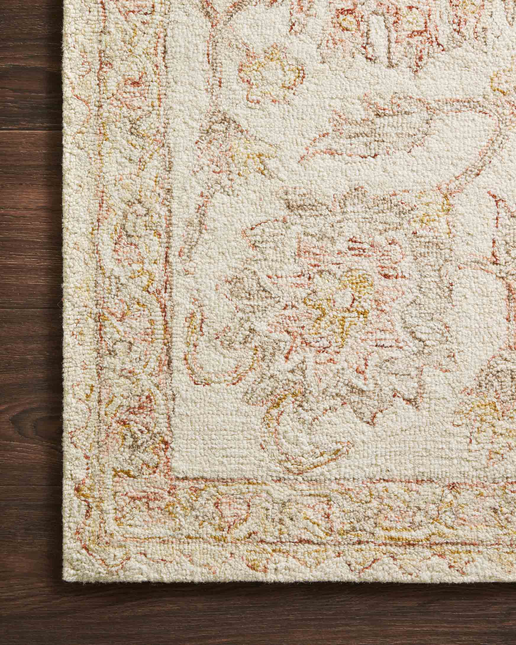Ivory and blush hooked rug border detail with dense loop texture