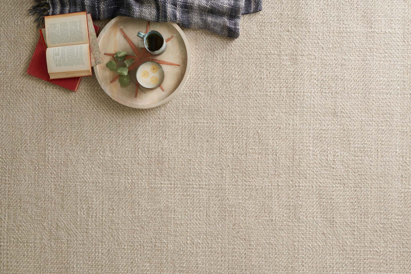 Textured hand-woven rug in light gravel beige with dense flat woven pattern