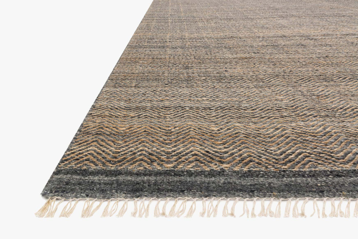 Ink hand-woven rug with zigzag texture and short fringe along edge
