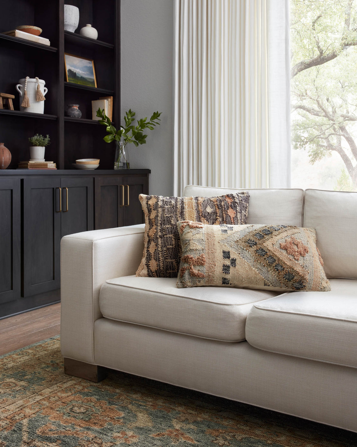 Geometric hand-woven pillow with beige fabric and blue-brown pattern