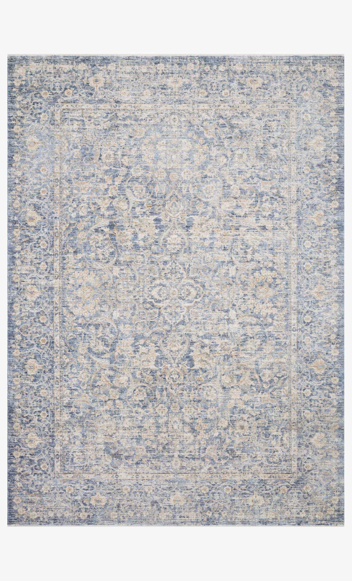 Blue and gold traditional power-loomed rug with ornate abstract pattern.