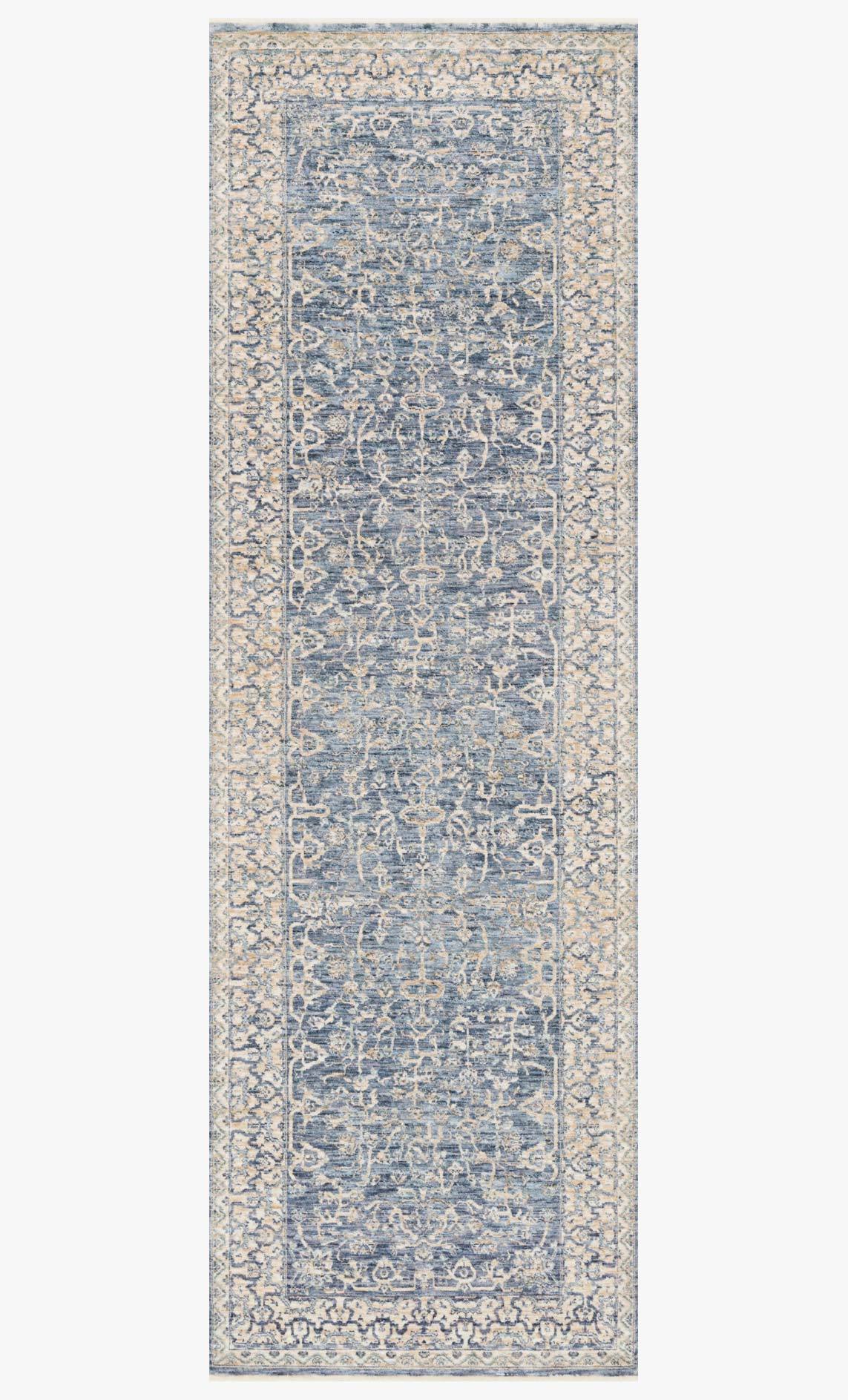 Traditional power-loomed runner rug in blue and ivory with repeating ornamental pattern