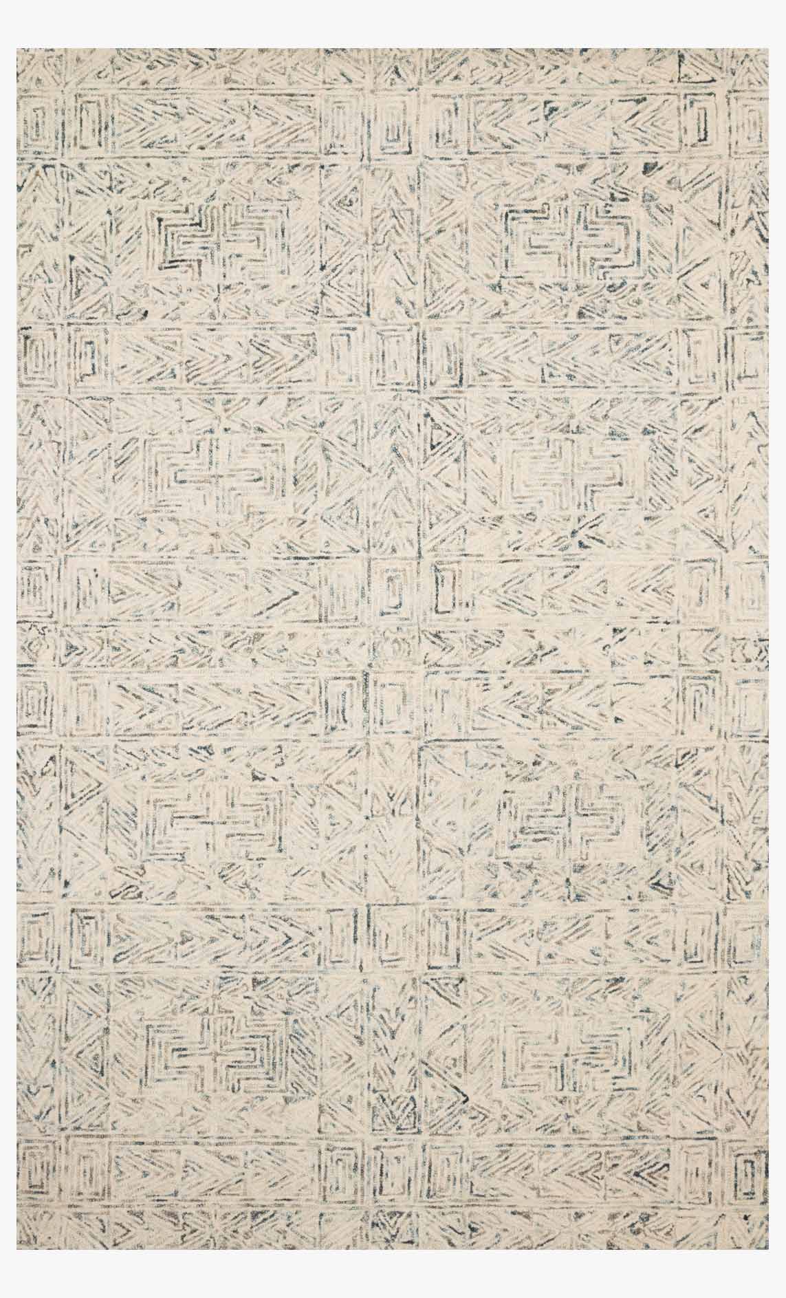 Contemporary hand-tufted rug with light blue geometric pattern on ivory base
