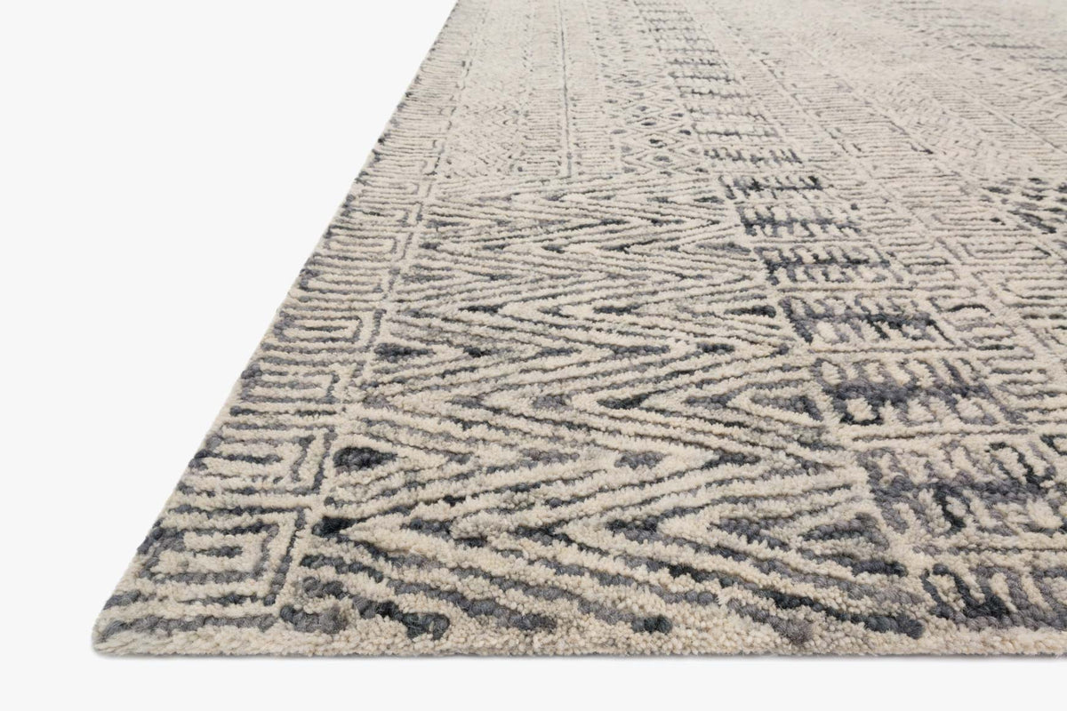 Charcoal hand-tufted rug corner view with abstract geometric patterns