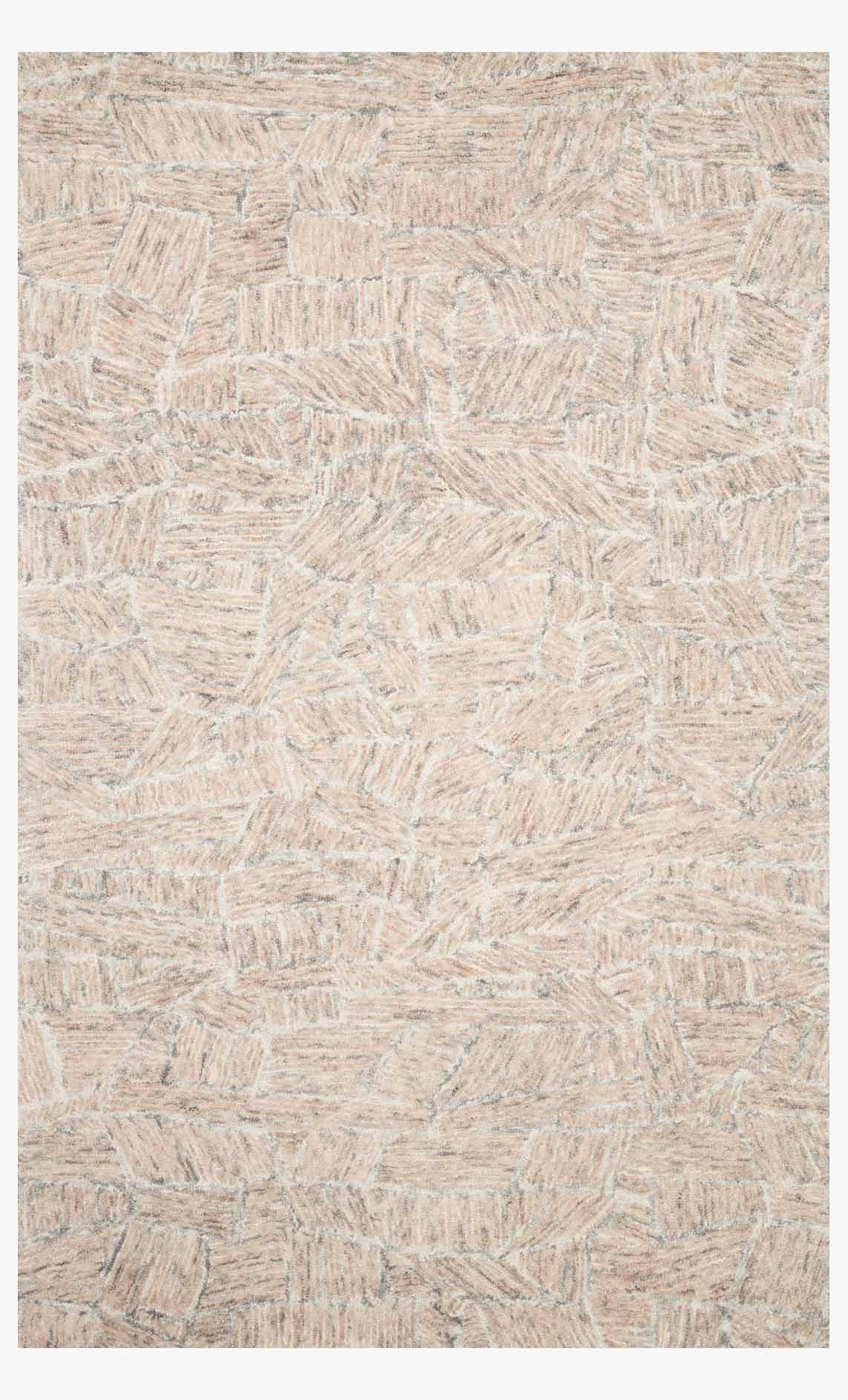 Blush hand-tufted rug with textured geometric abstract pattern