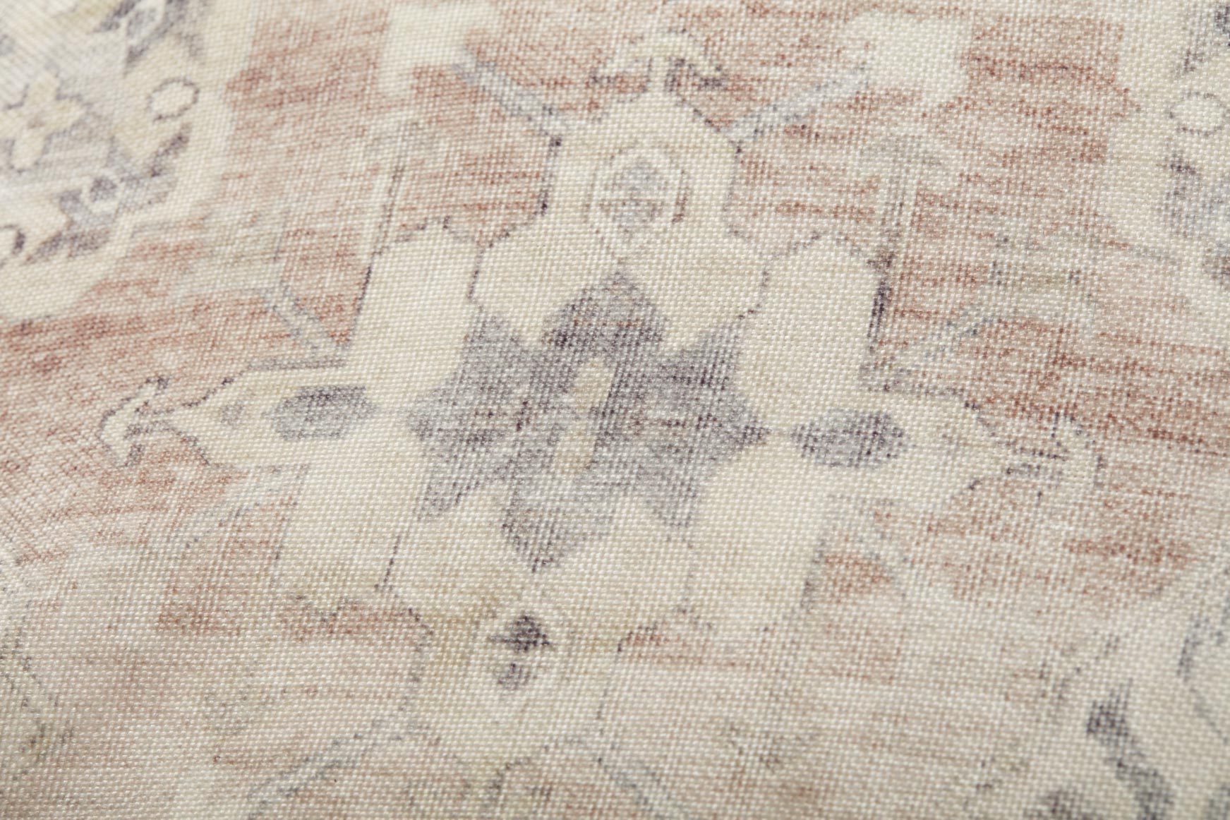 Beige fabric pouf top with gray and rust geometric pattern texture