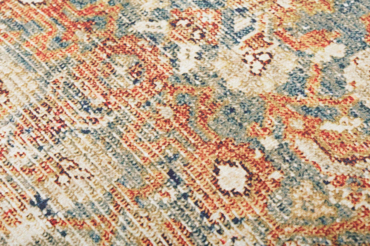 Woven rug pouf fabric close-up with rust, cream, and blue medallion pattern