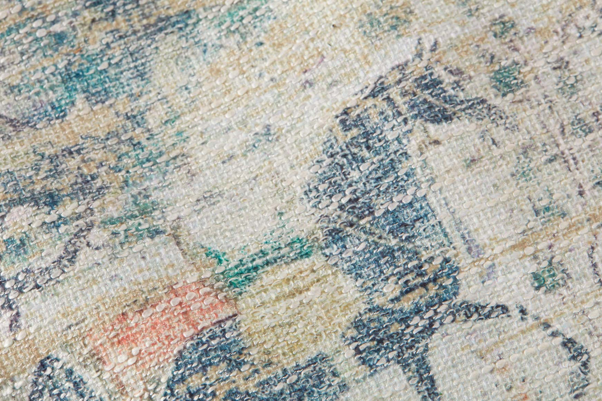 Woven upholstery fabric for pouf: blue, teal, and cream abstract pattern texture.