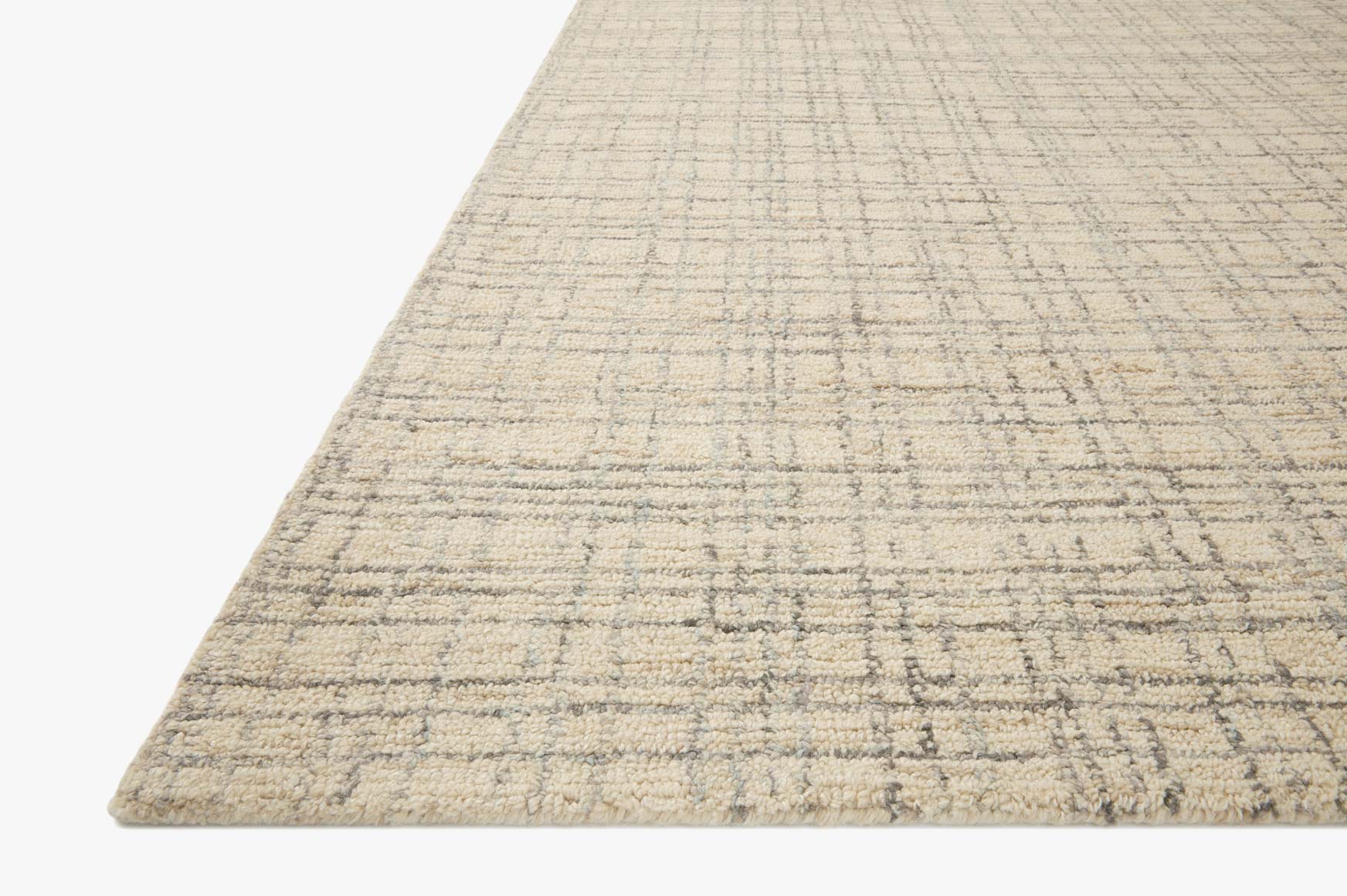 Light beige and pale blue hand-tufted grid area rug, angled corner view.