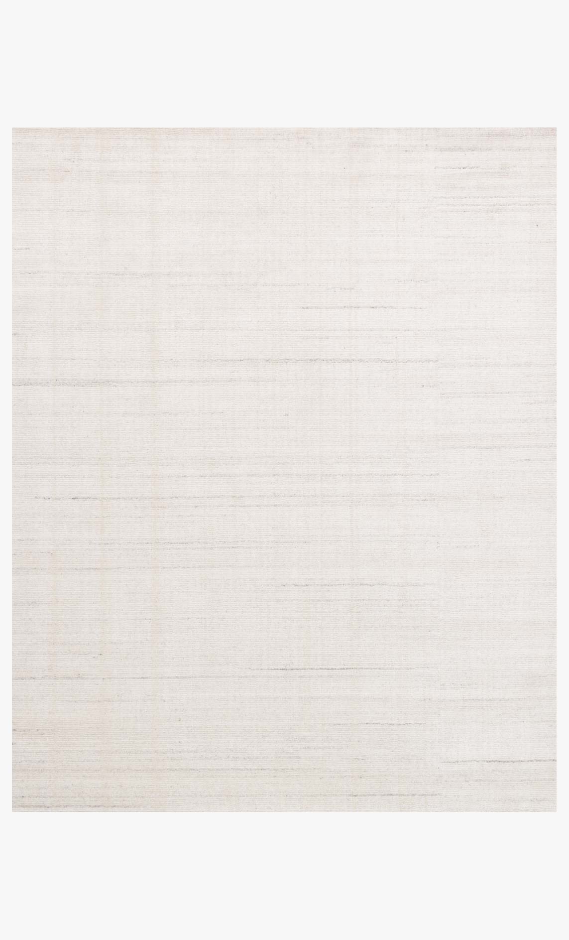 Transitional hand loomed rug in ivory with subtle linear texture and border edges