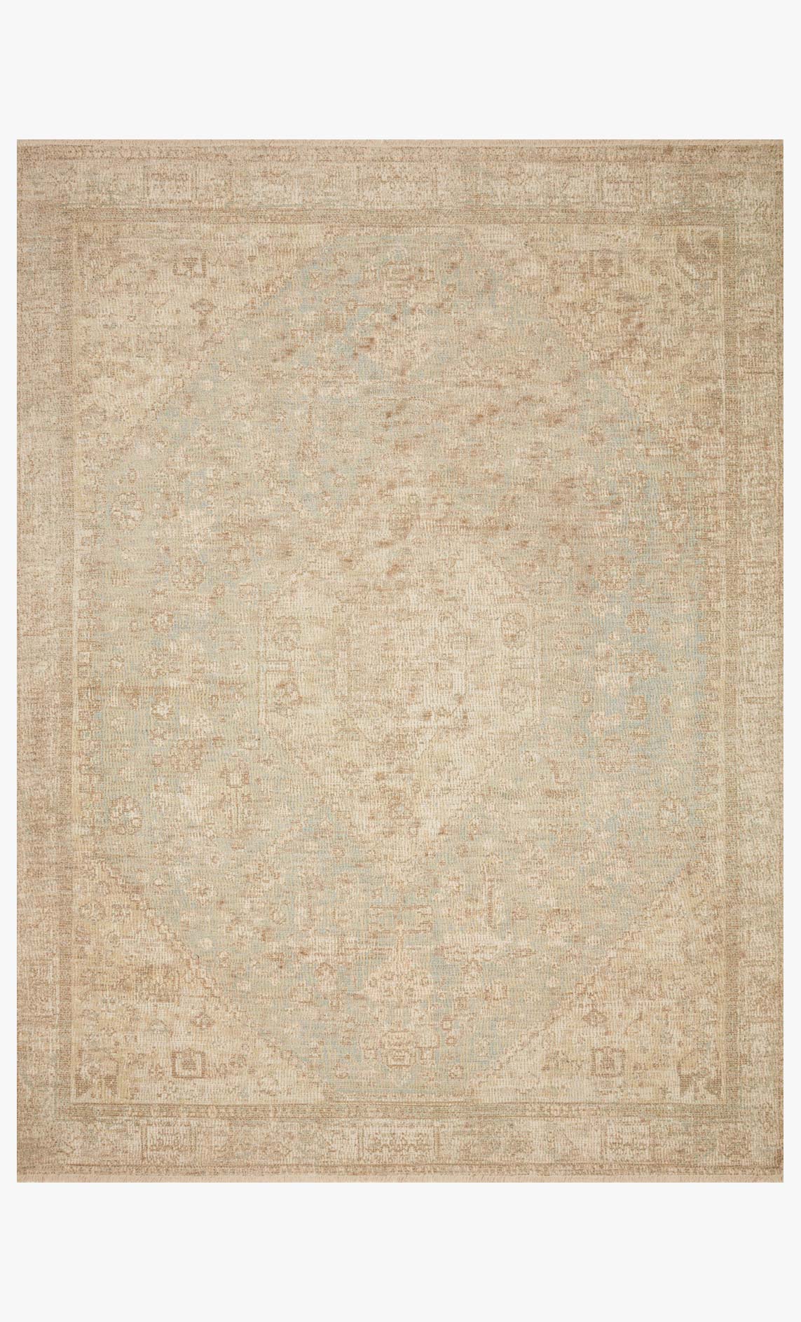 Ivory and ocean transitional hand-woven rug with geometric pattern and fringed edges