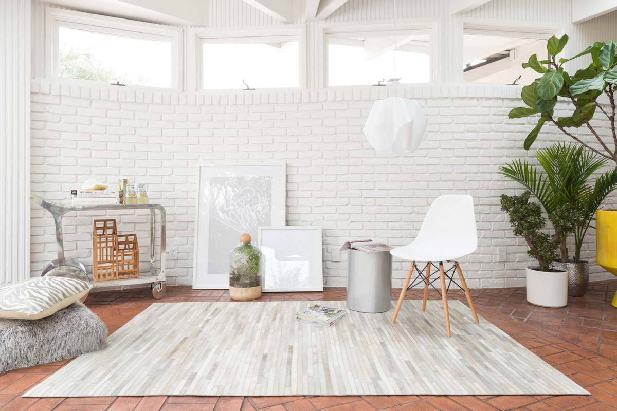 Ivory linear-striped area rug with hand-stitched look and distressed highlights