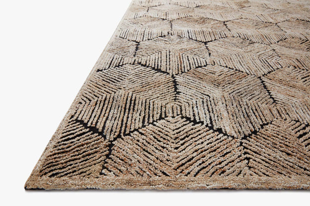 Beige hooked rug corner with textured geometric diamond pattern