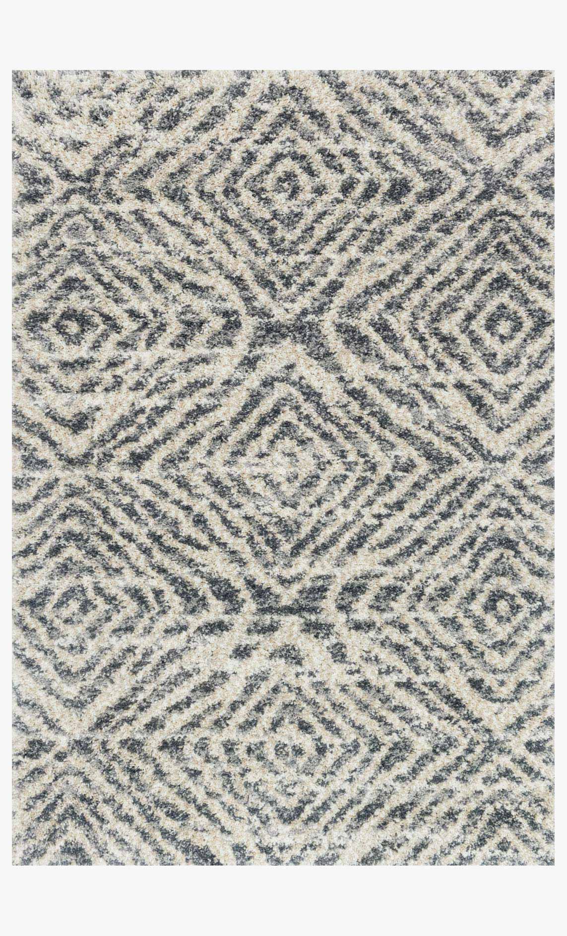 Shag rug with abstract geometric pattern in graphite and sand, power-loomed