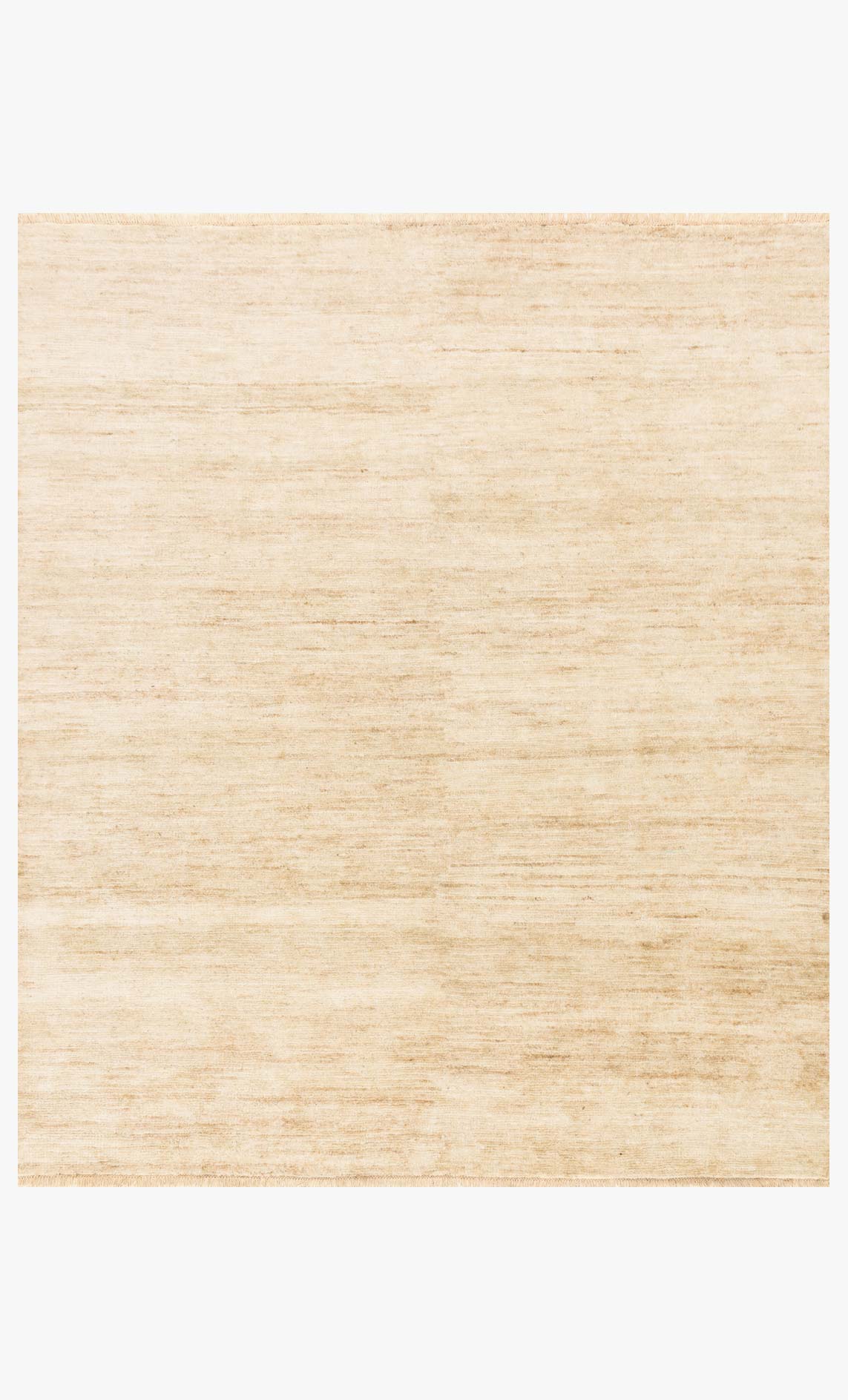 Loloi Quinn ivory hand-knotted rug with subtle linear pattern