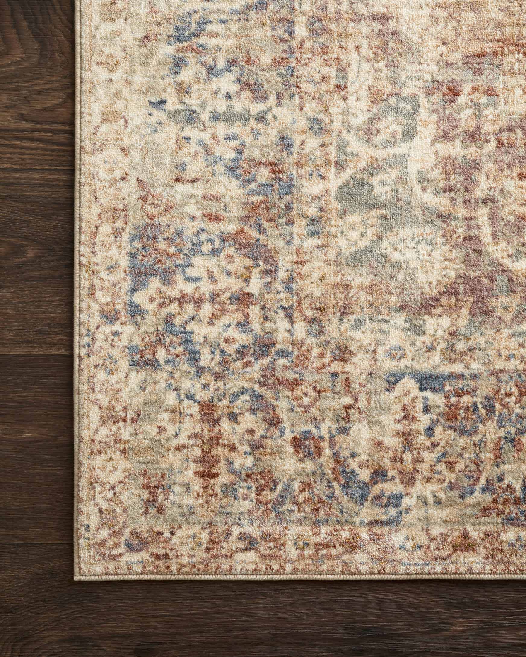 Close-up of power-loomed rug edge with multi-color distressed texture