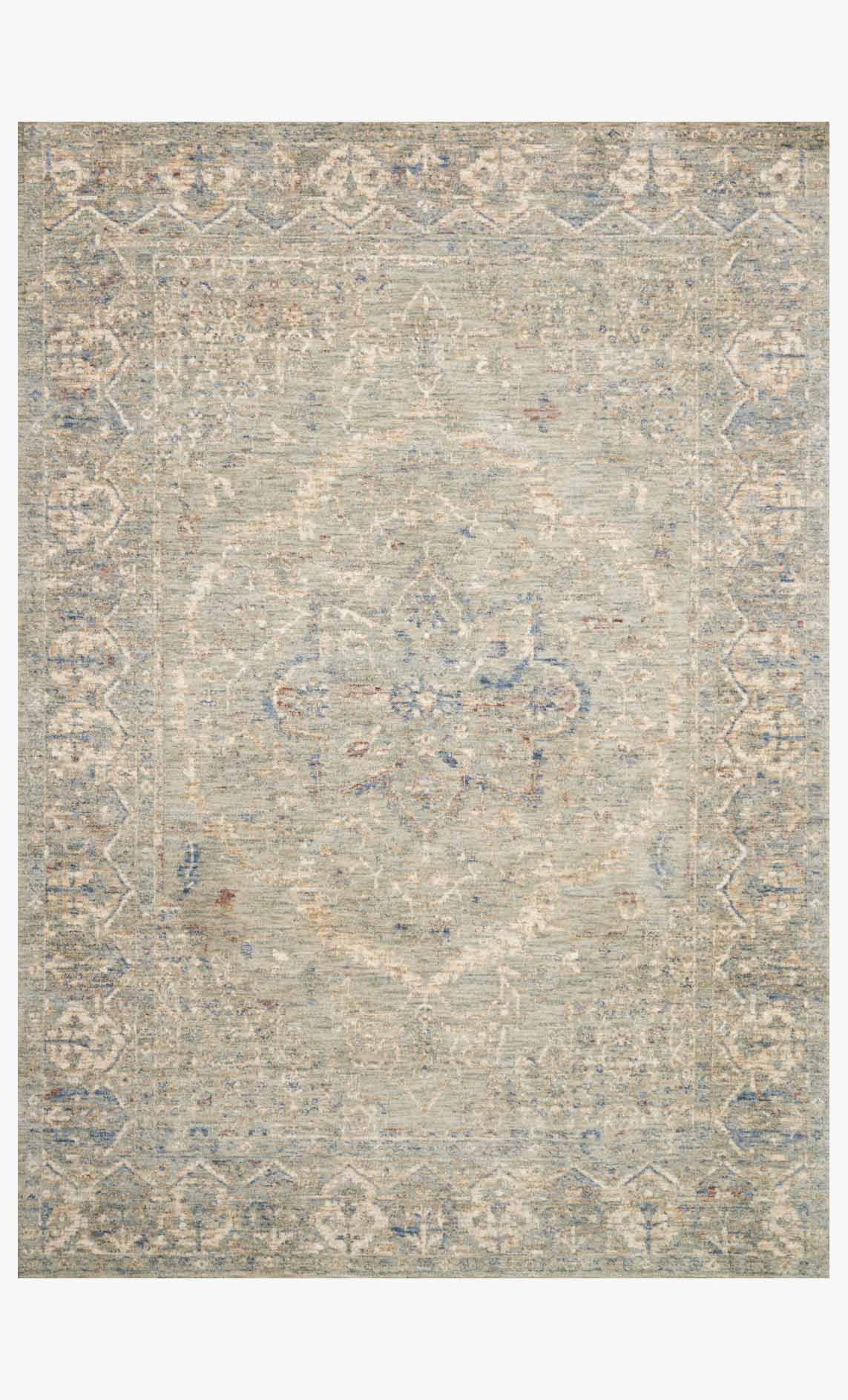 Traditional power-loomed rug with distressed geometric medallion pattern, light mist tones