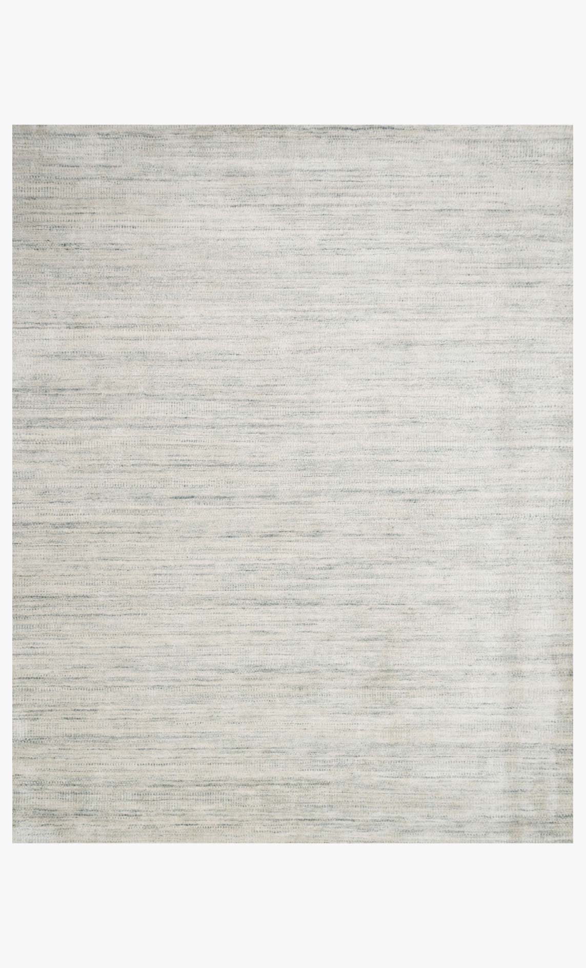Contemporary hand-loomed rug in silver-gray with subtle linear pattern, flat weave.