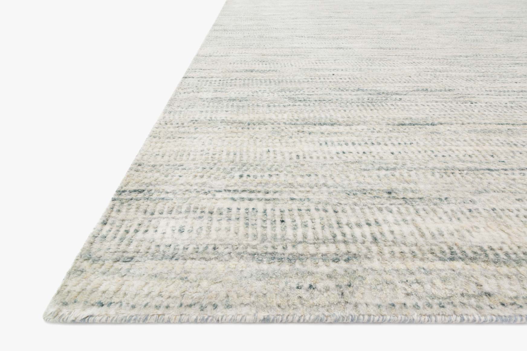 Silver-gray contemporary rug with low-profile flat weave, corner angled, subtle stripe lines.