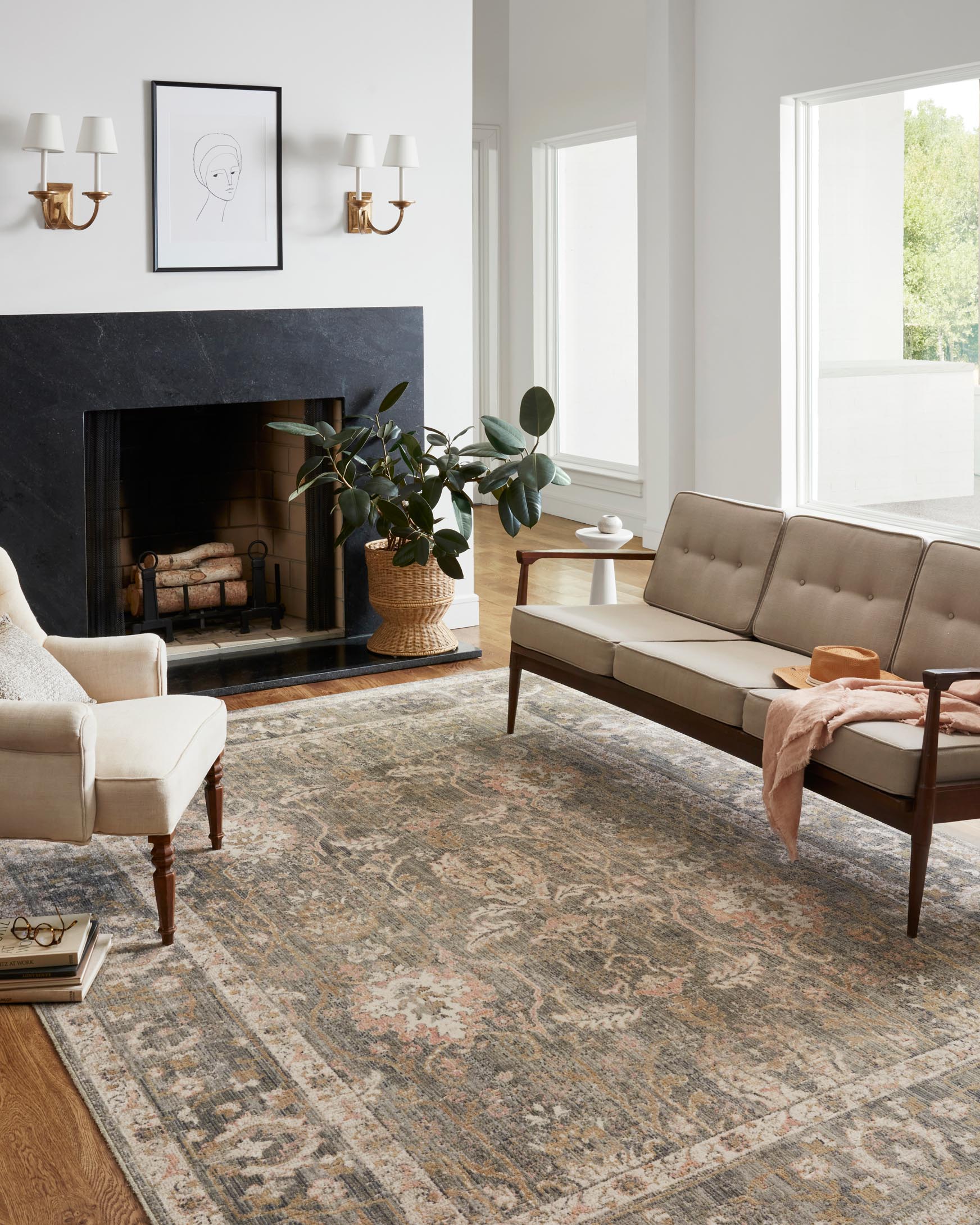 Muted traditional area rug with detailed scrolling pattern in sage, blush, and ivory.