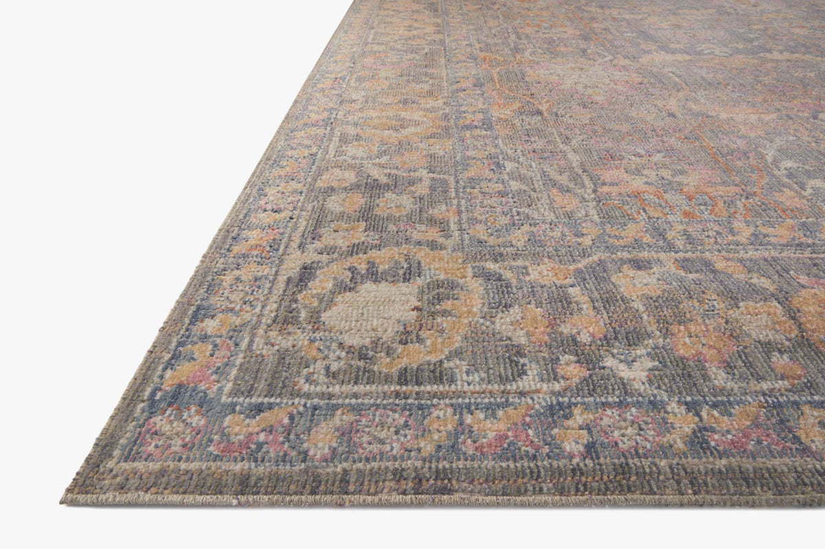 Close-up of stone-toned traditional area rug weave with multicolor abstract motif