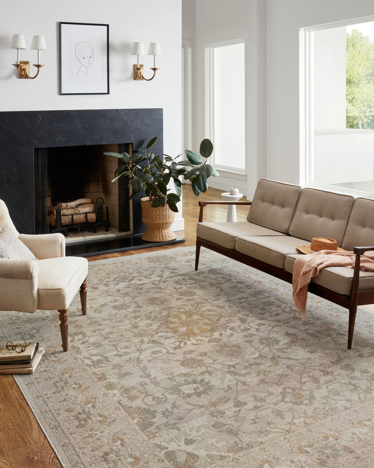 Ivory and natural area rug with ornate vintage pattern, flat on the floor