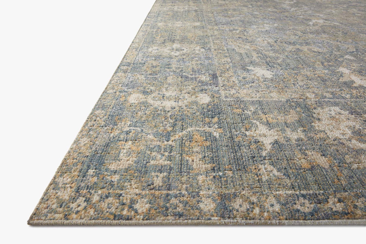 Sand and lagoon rug corner detail with distressed pattern and short woven pile