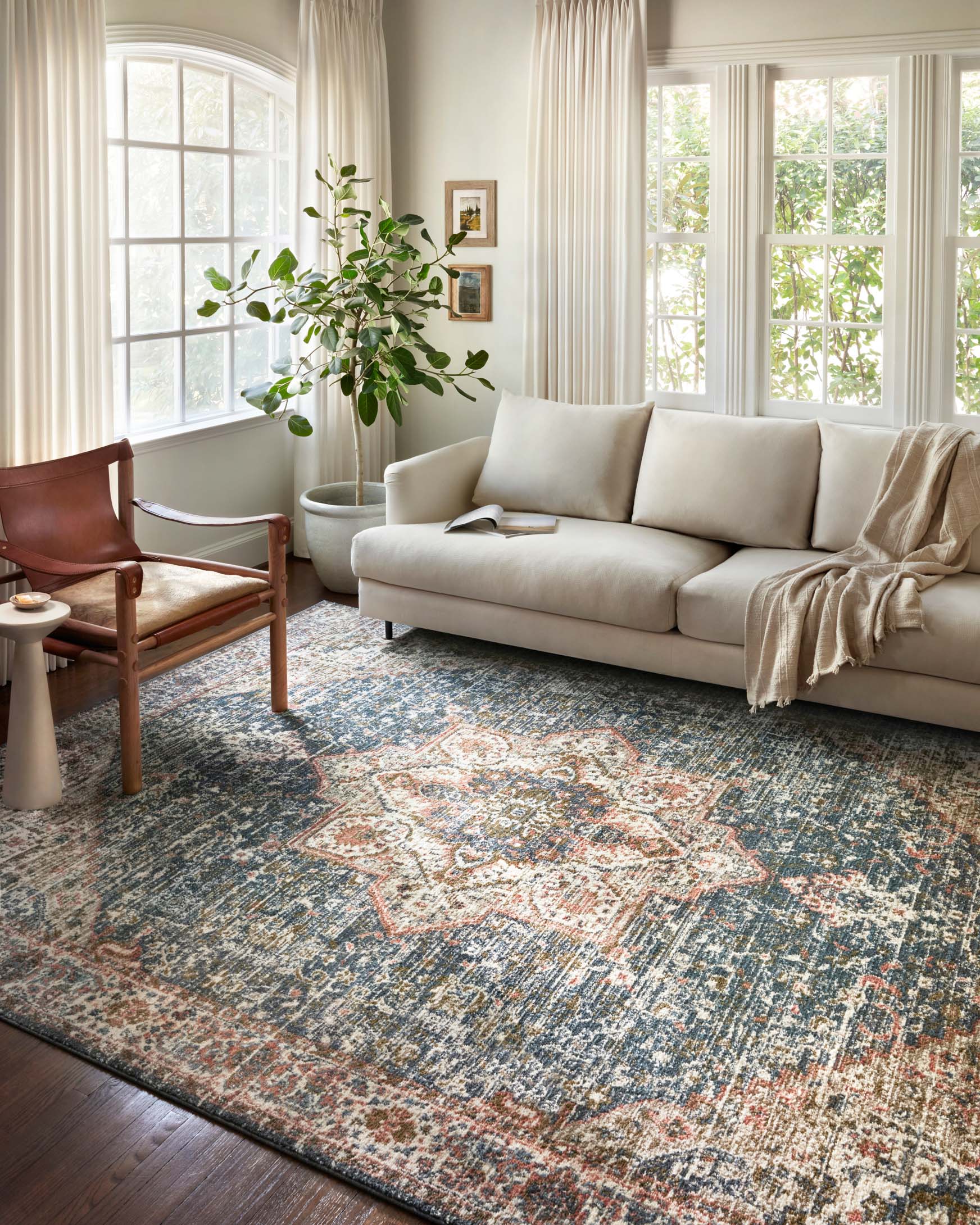 Traditional power-loomed rug with multicolor vintage pattern on a blue ground