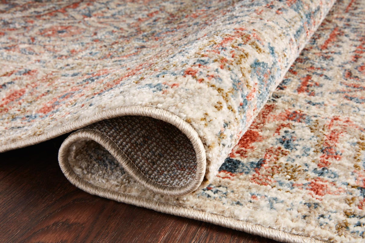 Close-up of traditional rug edge showing textured loop pile and sand base