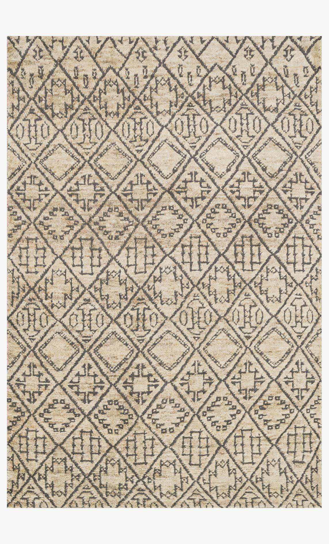 Sand hand-knotted rug with geometric diamond pattern in tan and dark blue.