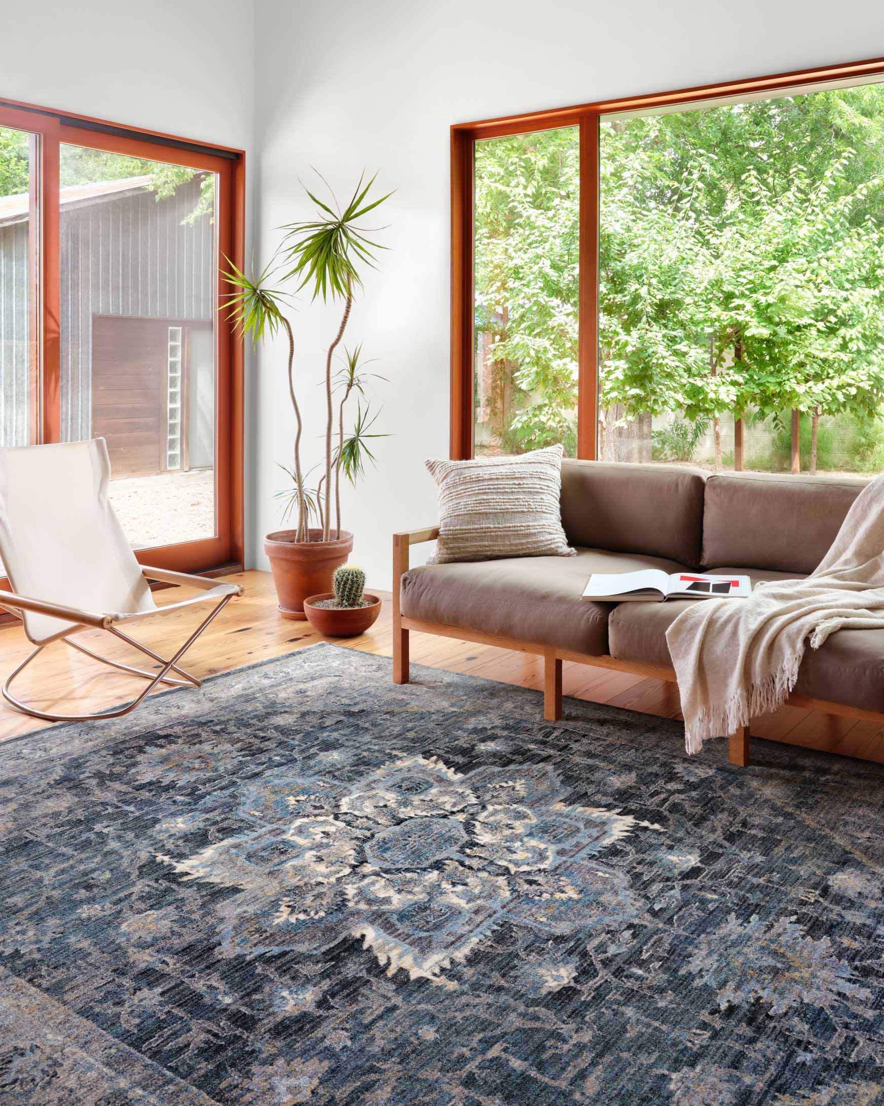 Denim and grey power-loomed area rug with distressed medallion pattern