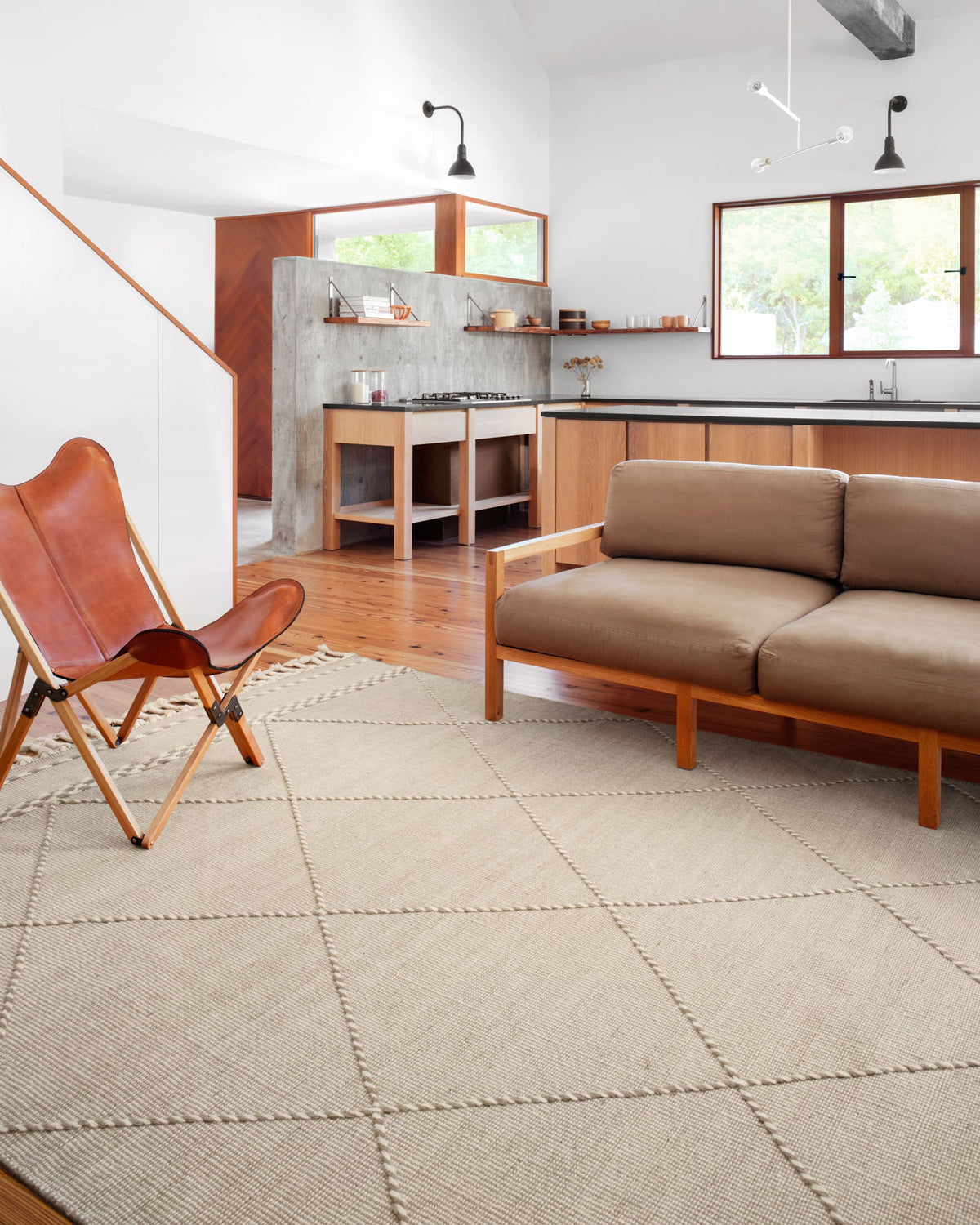 Sand beige area rug with diamond lattice design and tassel fringe ends