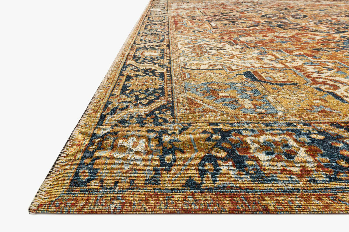 Corner view of red, navy and cream traditional patterned rug with border