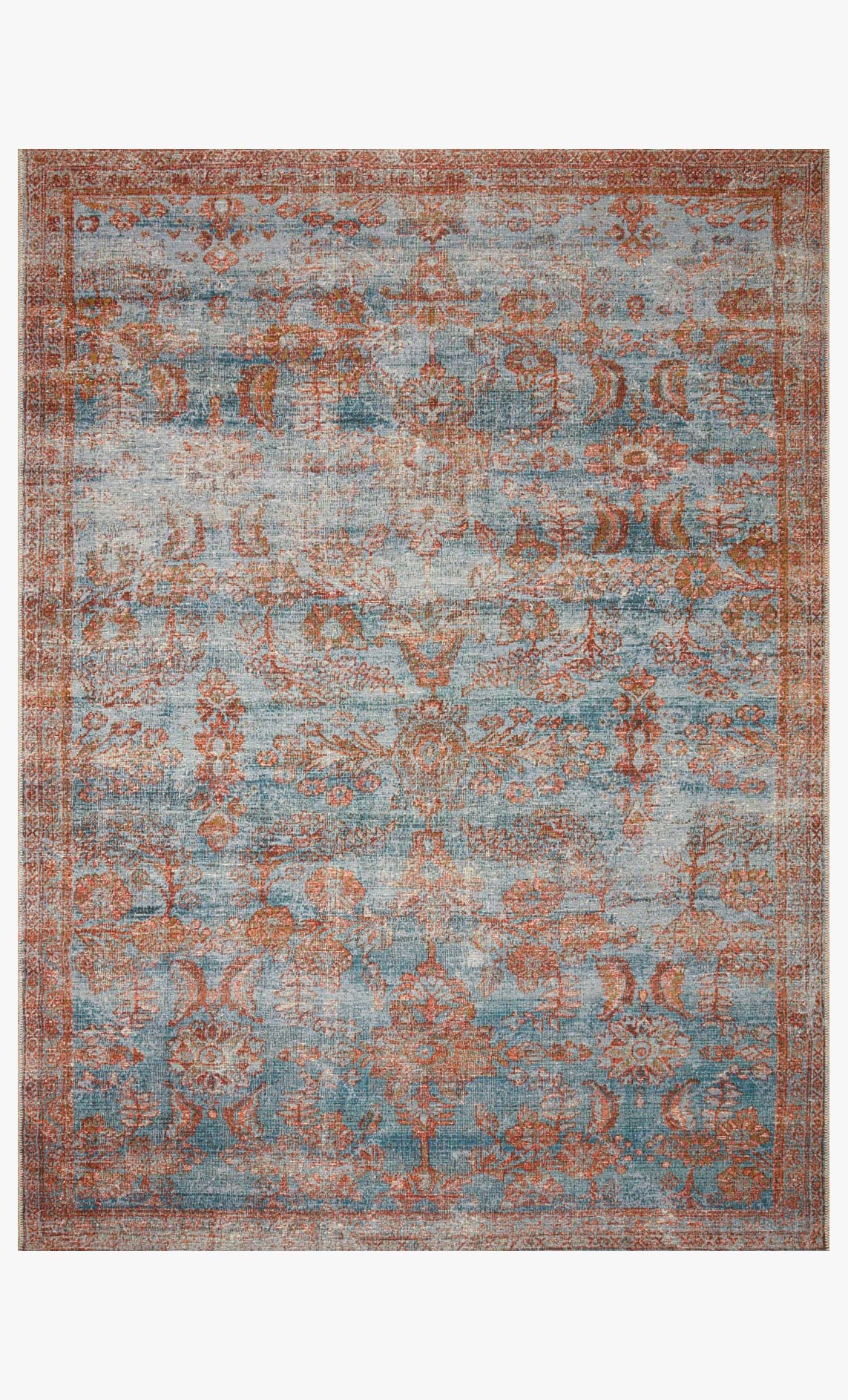 Traditional power-loomed rug in ocean blue with orange-spice patterned motifs, bordered edge.