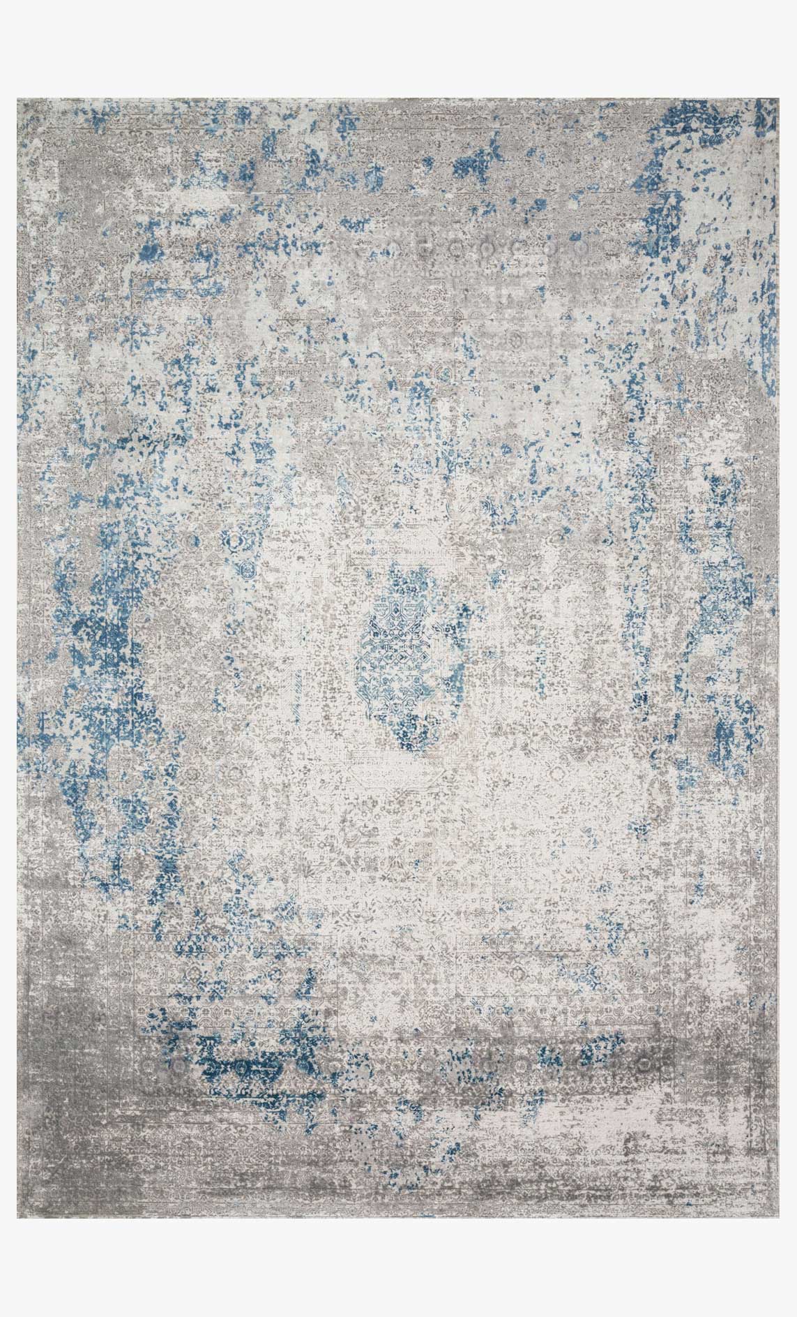 Contemporary power loomed rug with blue distressed pattern on light dove base.