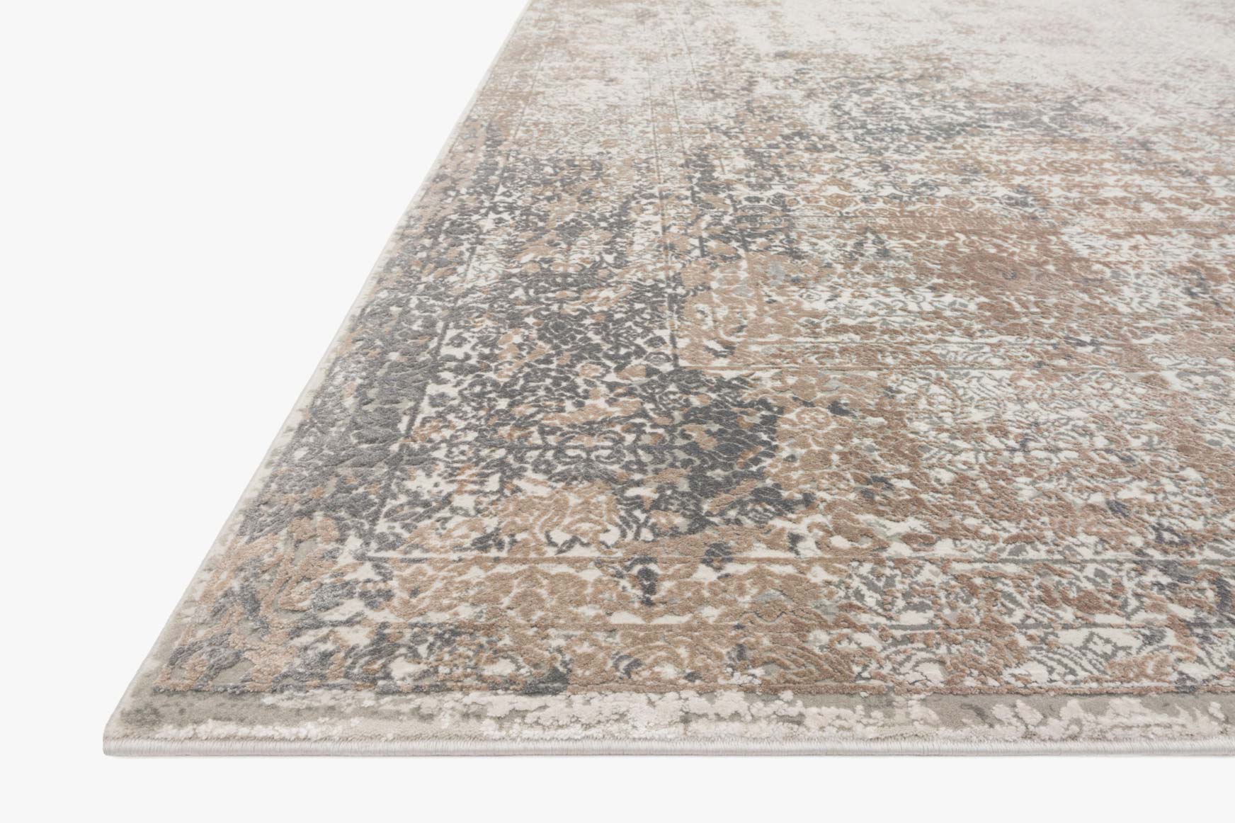 Ivory and pebble power-loomed rug corner with layered distressed abstract design