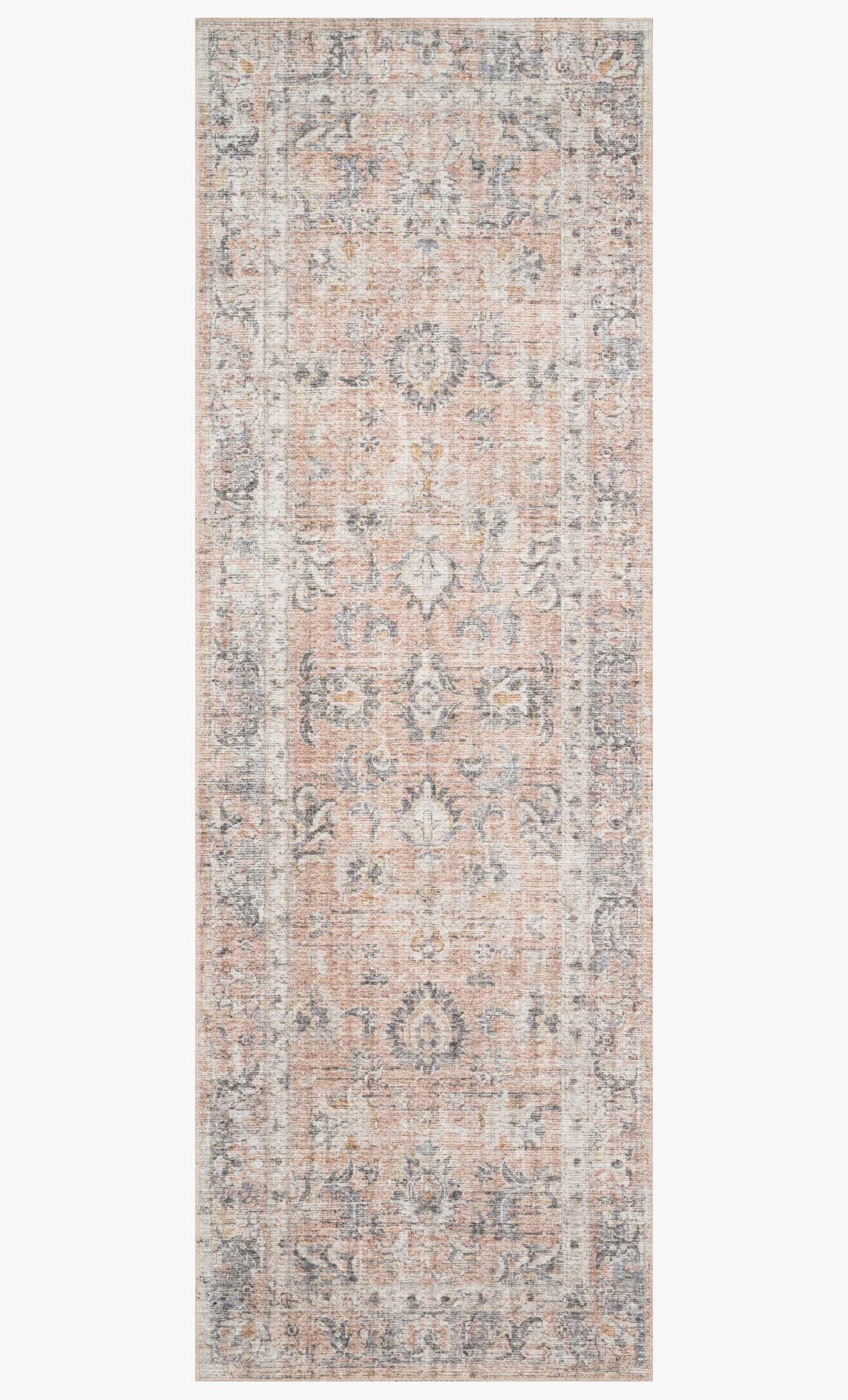 Blush and grey traditional rug with distressed ornate medallion pattern, rectangular.