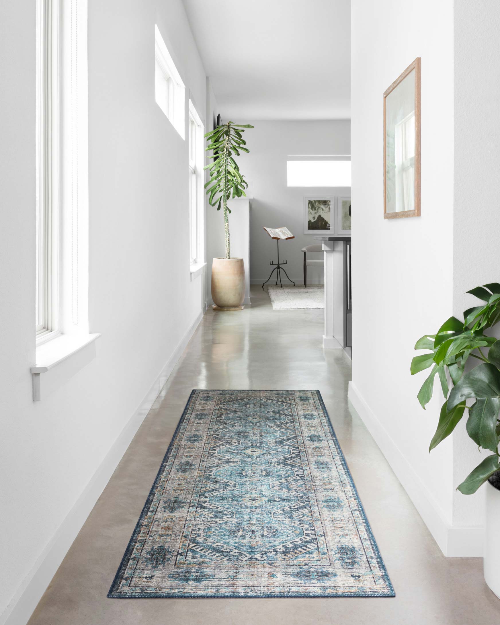Denim blue traditional runner rug with distressed geometric motif