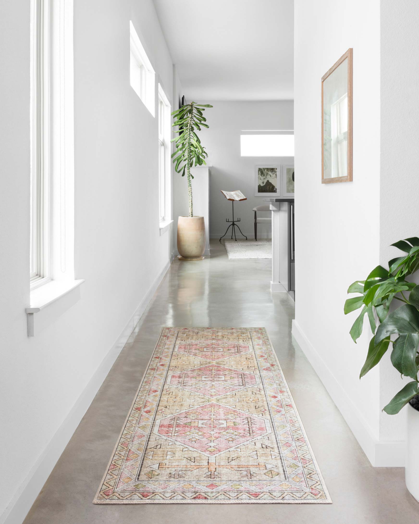 Traditional runner rug with distressed geometric motif in cream, gold, and blush tones